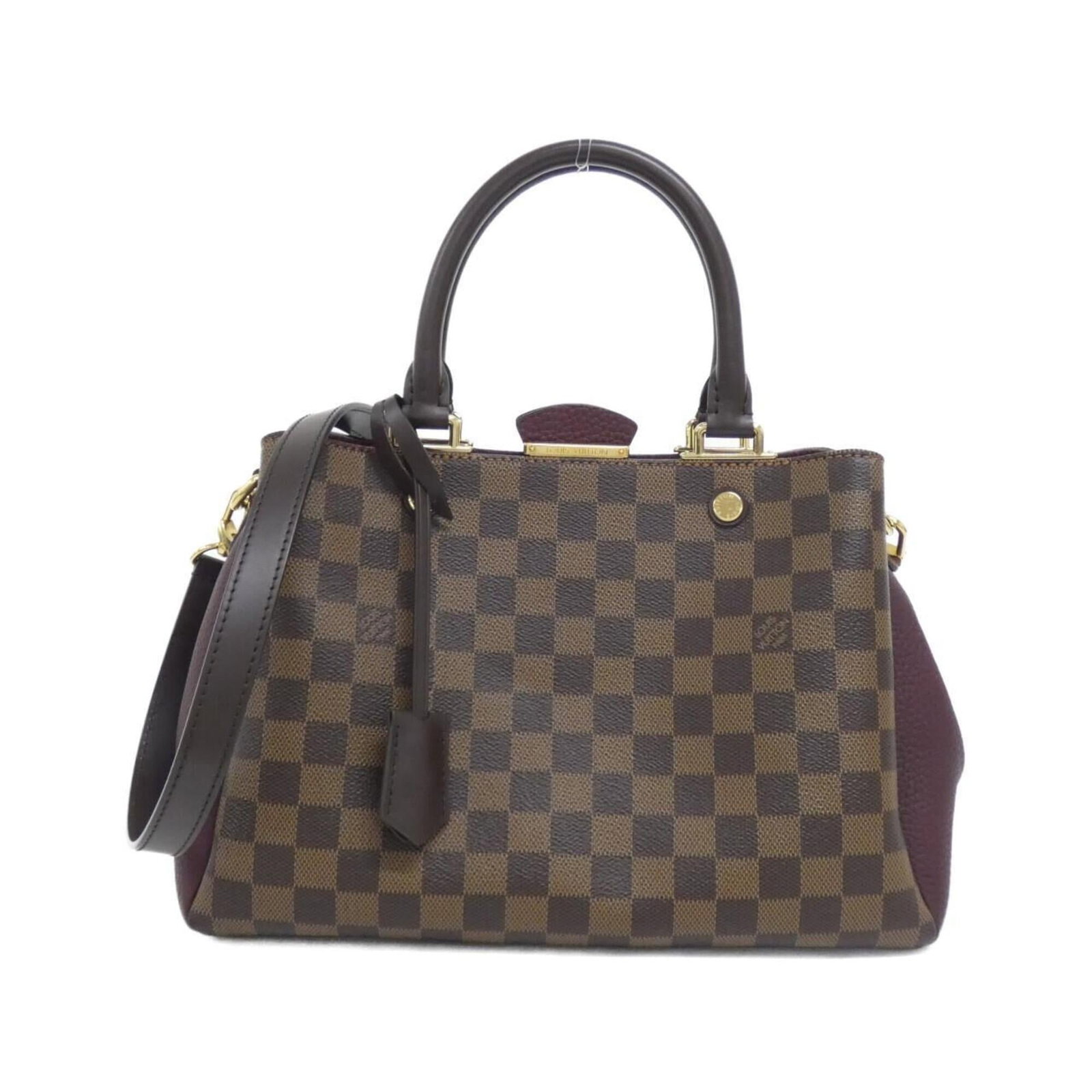 Louis Vuitton Handbag Coated Canvas: Louis Vuitton Handbag Coated Canvas Coated canvas construction provides a durable and stylish finish for this Louis Vuitton handbag. The Bordeaux and Ebene color combination adds a touch of elegance, 
