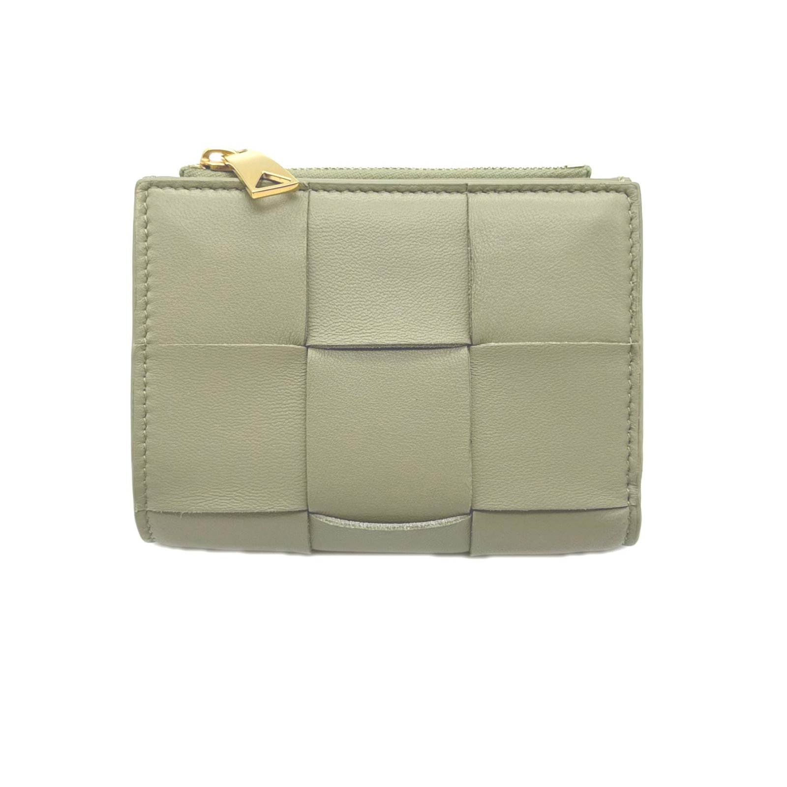 Bottega Veneta Wallet (Bi-Fold) Leather: Bottega Veneta Wallet (Bi-Fold) Leather Bottega Veneta's bi-fold wallet is crafted from luxurious lambskin leather in a soft beige hue. Measuring 9cm x 11.5cm x 1.5cm, this wallet features a classic d