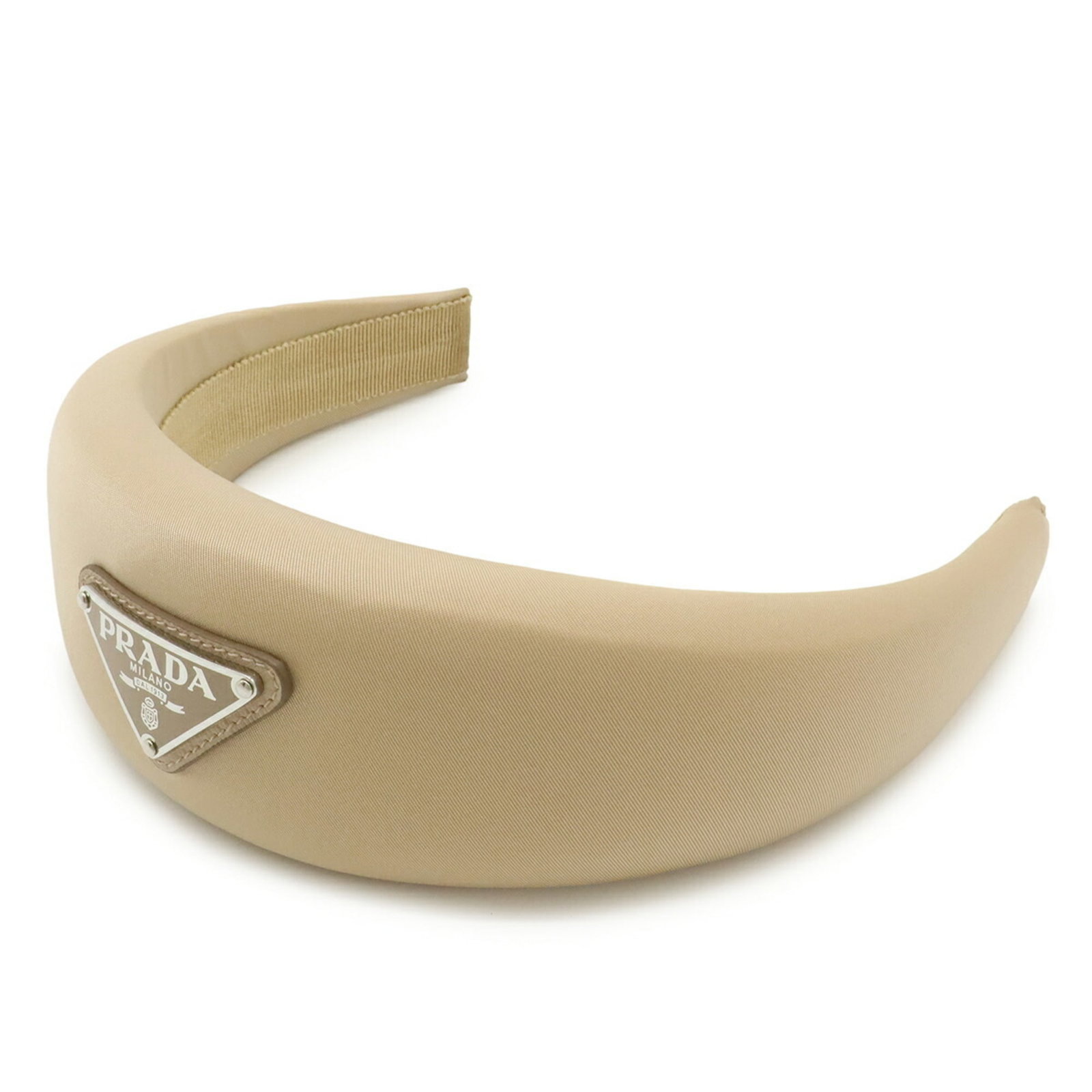Band Nylon Prada Alice: Band Nylon Prada Alice The Prada Alice band is a stylish accessory made from high-quality nylon, measuring 34.5cm x 6cm. This compact bag comes with a box and dust bag for added convenience, making