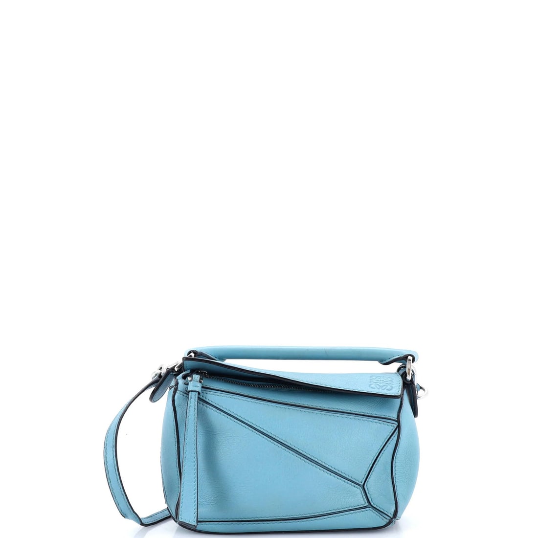Loewe Puzzle Bag Leather Mini: Loewe Puzzle Bag Leather Mini The Loewe Puzzle Bag Leather Mini is a stylish cross body bag with a blue exterior and neutral interior. Noted for its distinctive puzzle design, this mini bag features a