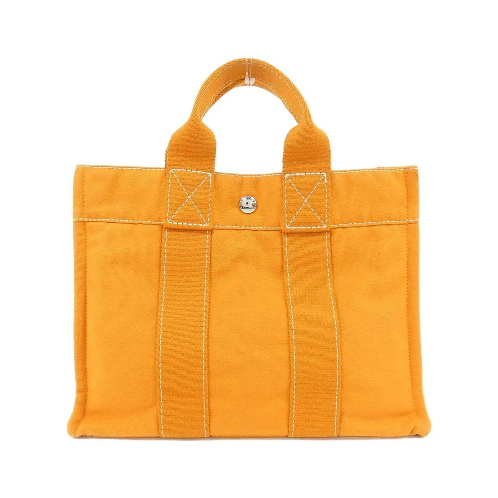 Handbag Canvas: Handbag Canvas Canvas handbag with vibrant orange color and silver hardware, measuring 23cm x 30cm x 8cm. This canvas handbag is a unique and eye-catching accessory. The canvas material provides a