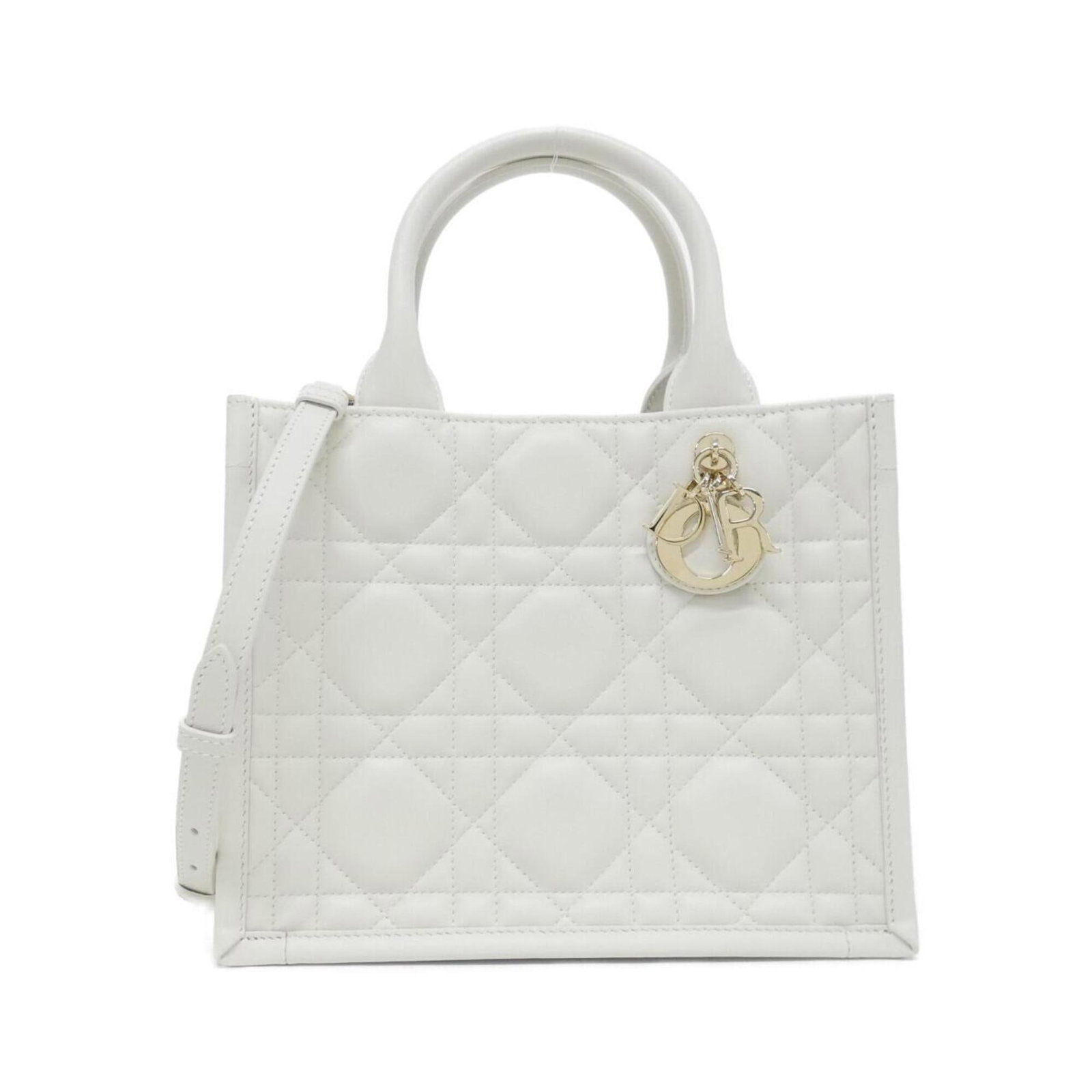 Handbag Leather Dior Christian: Handbag Leather Dior Christian White Calfskin Christian Dior Handbag with Leather/Fur Details. This elegant handbag boasts a classic design with a signature Dior touch, featuring premium leather and