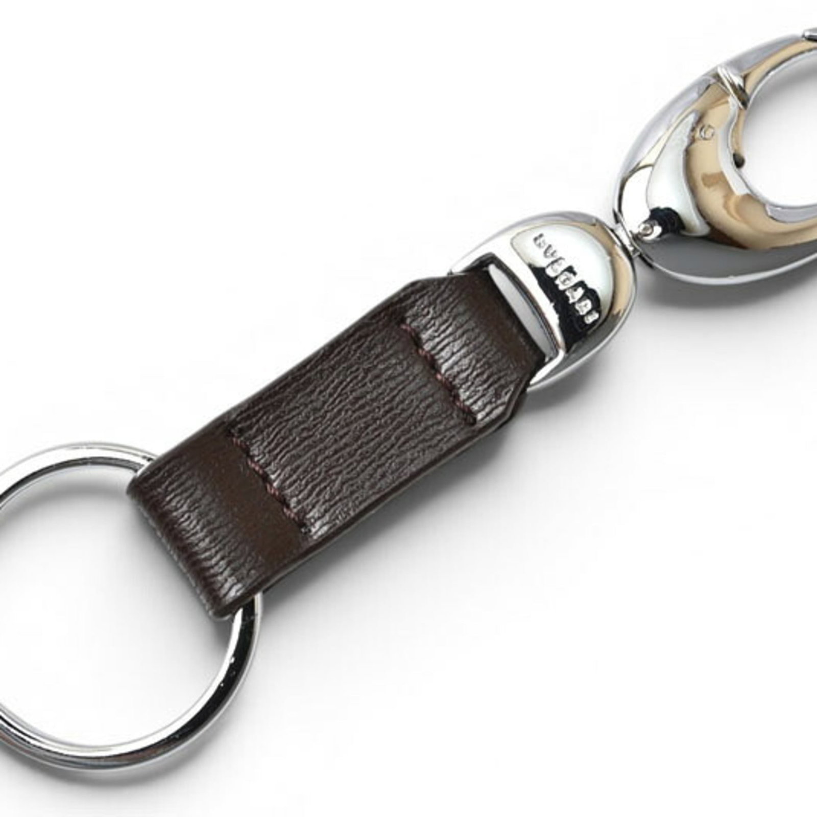Keyring Leather By Bvlgari: Keyring Leather By Bvlgari Bvlgari's Keyring Leather is a stylish accessory made from high-quality leather, featuring a classic design with a brown finish. The ring diameter is 3.2cm, making it a