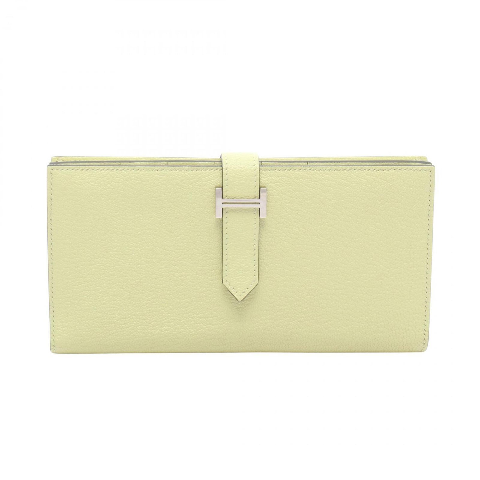 Chevre Leather Bi Fold Hermes Wallet: Chevre Leather Bi Fold Hermes Wallet Chevre leather provides a rich, buttery texture to this bi-fold wallet, while its yellow hue adds a touch of sunny elegance. Measuring 9cm x 17.5cm x 2cm, this com