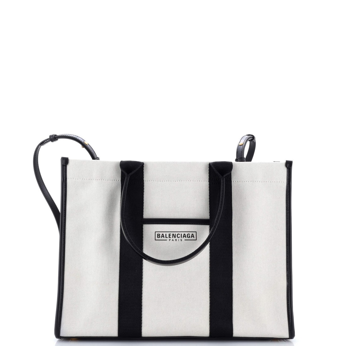 Canvas Medium Balenciaga Tote Hardware: Canvas Medium Balenciaga Tote Hardware Canvas Medium Balenciaga Tote with Aged Gold Hardware. This neutral-colored canvas tote features a classic design with a medium size and adjustable strap drop.