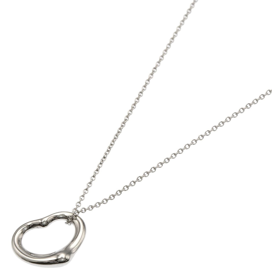 Open Heart Necklace by Tiffany & Co: Open Heart Necklace by Tiffany & Co Open Heart Necklace by Tiffany & Co is a sleek and modern silver necklace featuring a striking design. Made from high-quality silver metal, this necklace boasts a c