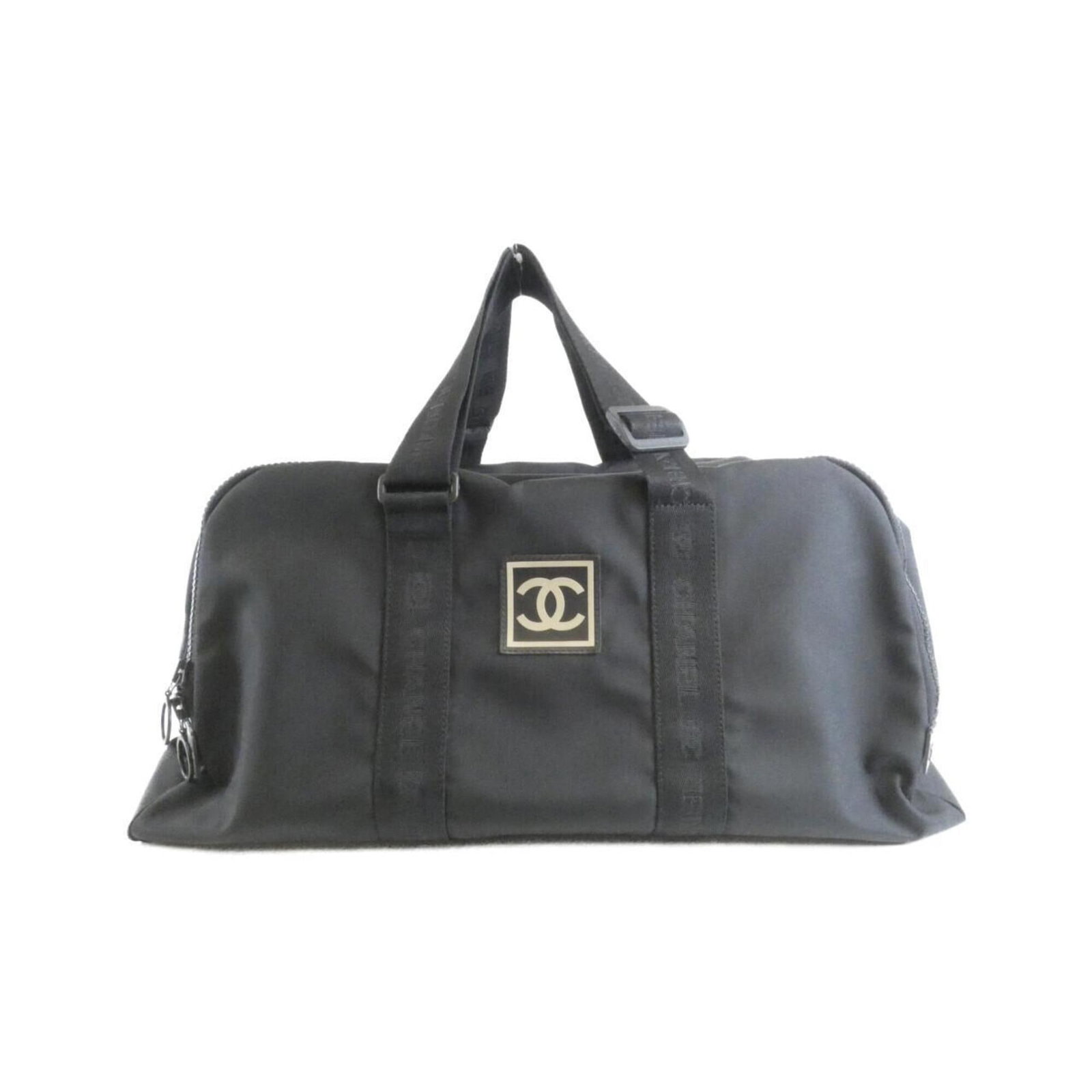 Shoulder Bag Canvas By Chanel: Shoulder Bag Canvas By Chanel Canvas shoulder bag in black from Chanel, featuring silver hardware and a classic design. The bag measures 30cm x 53cm x 26cm and is made from canvas material. This