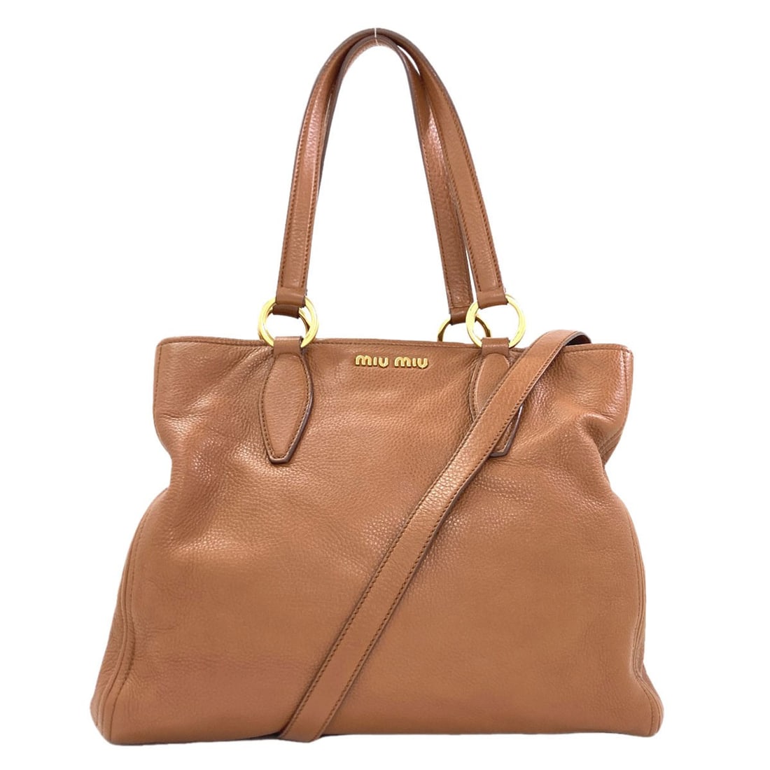 Miumiu 2Way Tote Bag Leather: Miumiu 2Way Tote Bag Leather Brown leather 2Way Tote Bag from MIUMIU, featuring a classic design with a signature. Made from high-quality leather, this tote bag is a stylish and practical accessory.