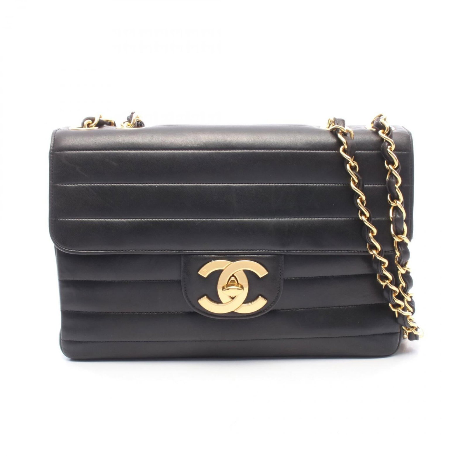 Shoulder Bag Leather Handbag Chanel: Shoulder Bag Leather Handbag Chanel This black lambskin shoulder bag from Chanel features a classic design with clean lines and a timeless aesthetic. Made from high-quality leather, the bag's 20.5cm x