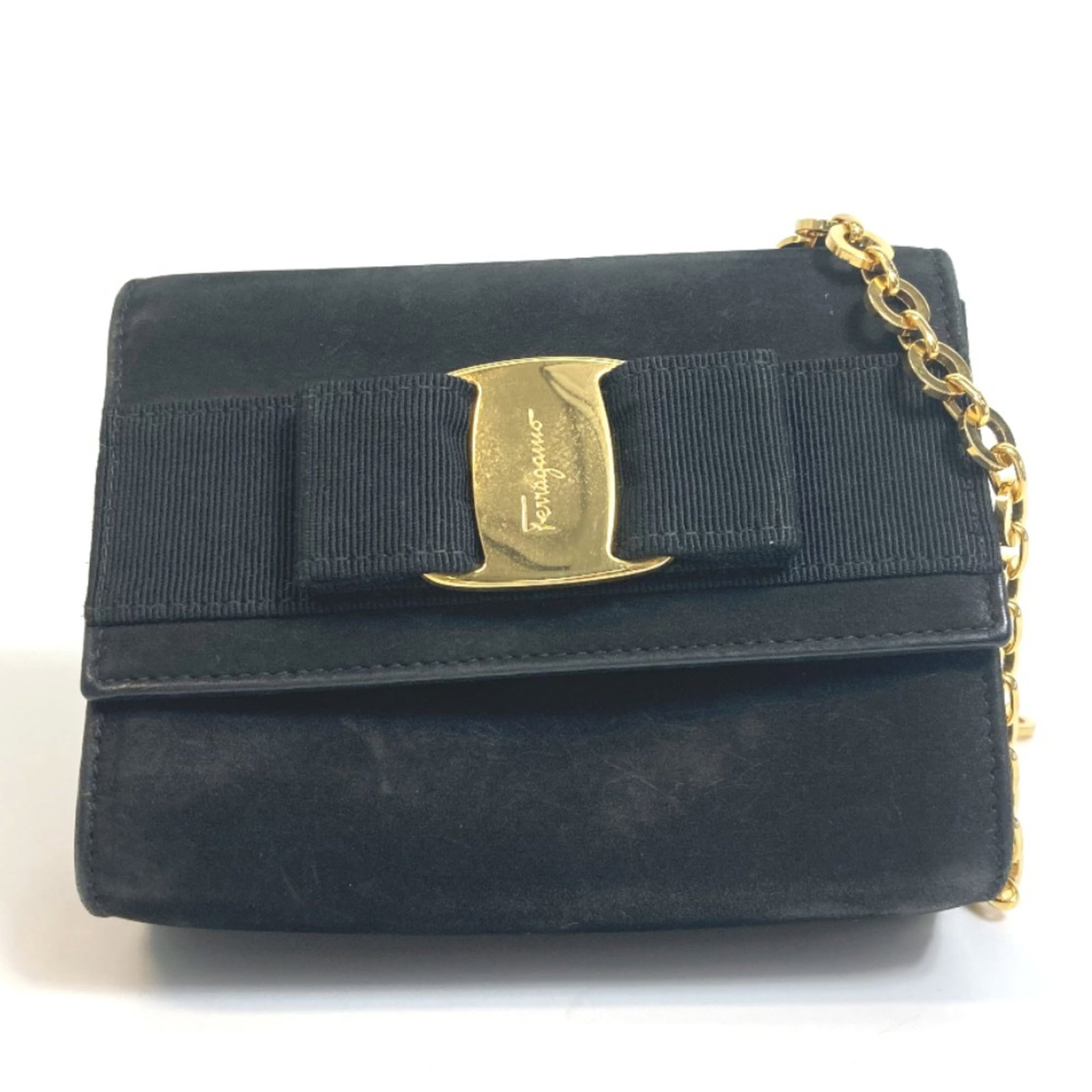 Ferragamo Leather Shoulder Bag: Ferragamo Leather Shoulder Bag Black leather shoulder bag from Salvatore Ferragamo, featuring a sleek design with clean lines and a classic shape. Measuring 14.5cm x 11.2cm x 5.5cm, it has a shoulder
