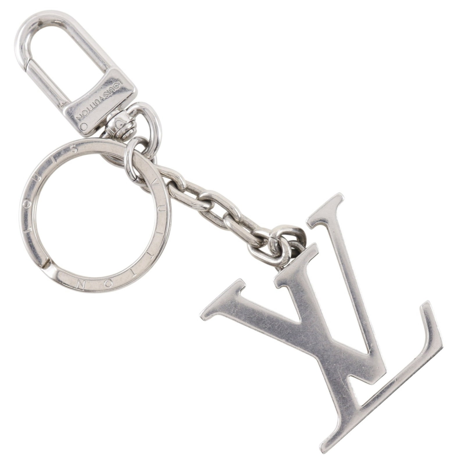 Keyring from Louis Vuitton: Keyring from Louis Vuitton Silver Louis Vuitton keyring, measuring 13.3cm x 4.5cm x 8.00mm, weighing 74g, featuring a sleek and sophisticated design. The keyring's compact size and weight make it a
