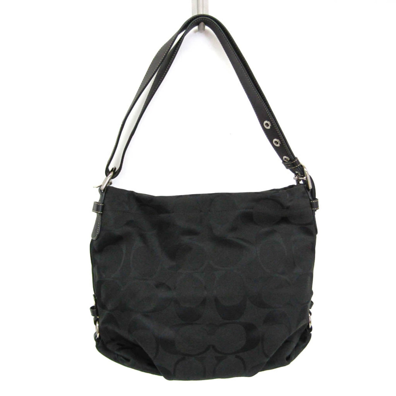 Canvas Leather Shoulder Bag Coach: Canvas Leather Shoulder Bag Coach Canvas Leather Shoulder Bag in Black. This Coach shoulder bag features a unique combination of canvas and leather materials, with a zipper closure and two functional 