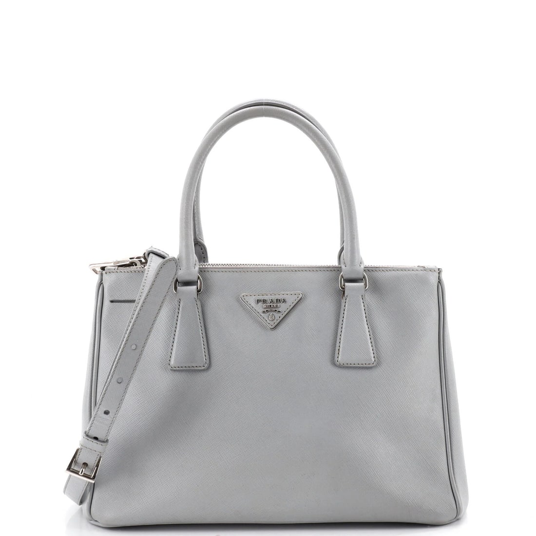 Prada Gardener's Tote Saffiano Leather Medium: Prada Gardener's Tote Saffiano Leather Medium Gray Saffiano Leather Medium Prada Gardener's Tote with classic design and durable exterior, featuring a medium size and silver hardware. The exterior