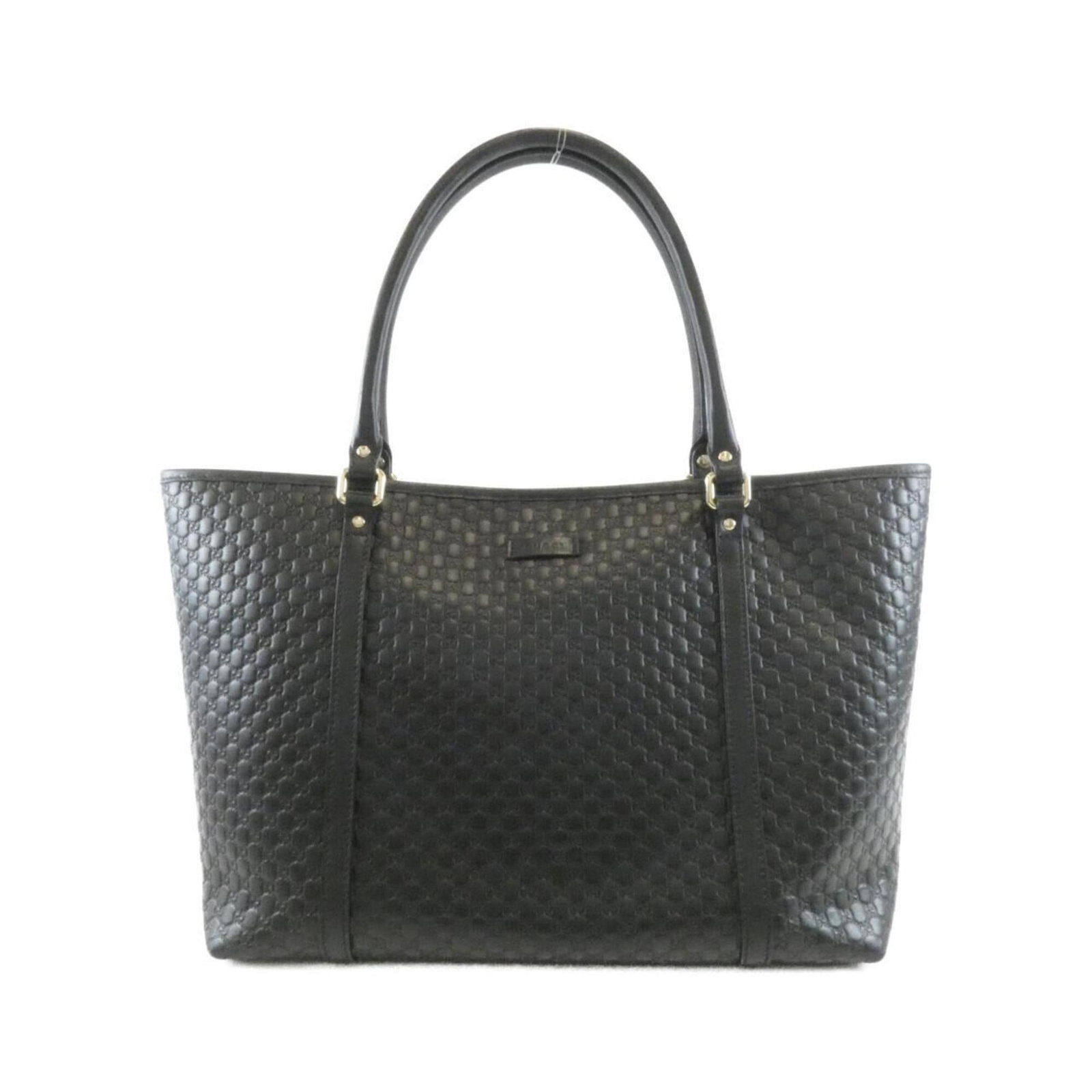 Gucci Handbag Leather: Gucci Handbag Leather GG leather construction provides a luxurious feel to this black Gucci handbag, with a classic design that exudes timeless elegance. Measuring 26cm x 44cm x 15cm, the bag's sleek 