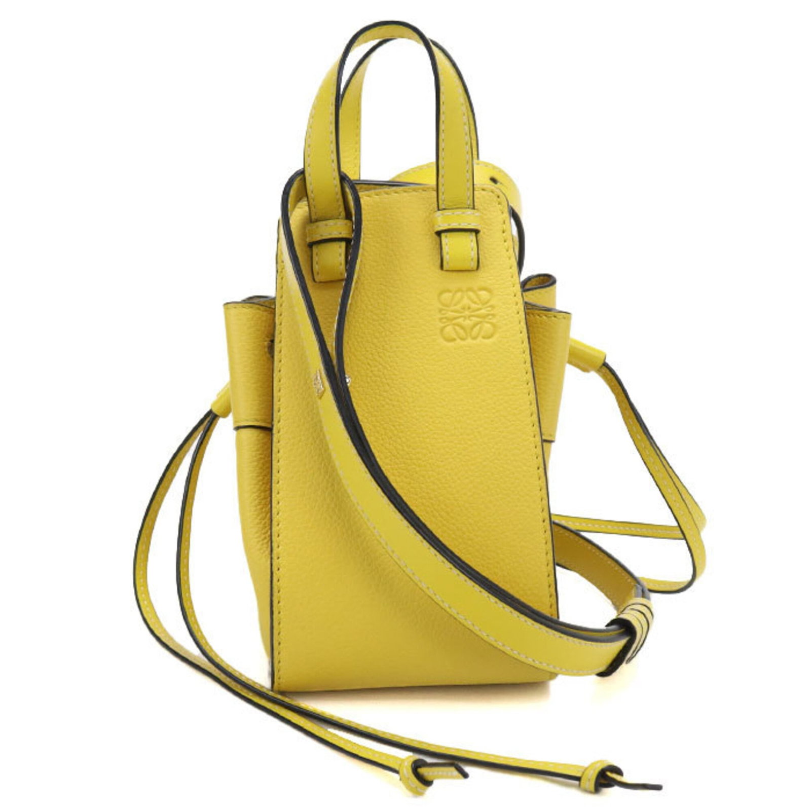 Handbag Leather Handbag: Handbag Leather Handbag Handbag bears a signature. Made from high-quality calfskin leather, this yellow handbag features gold hardware and a classic design. Its compact size makes it a stylish and por
