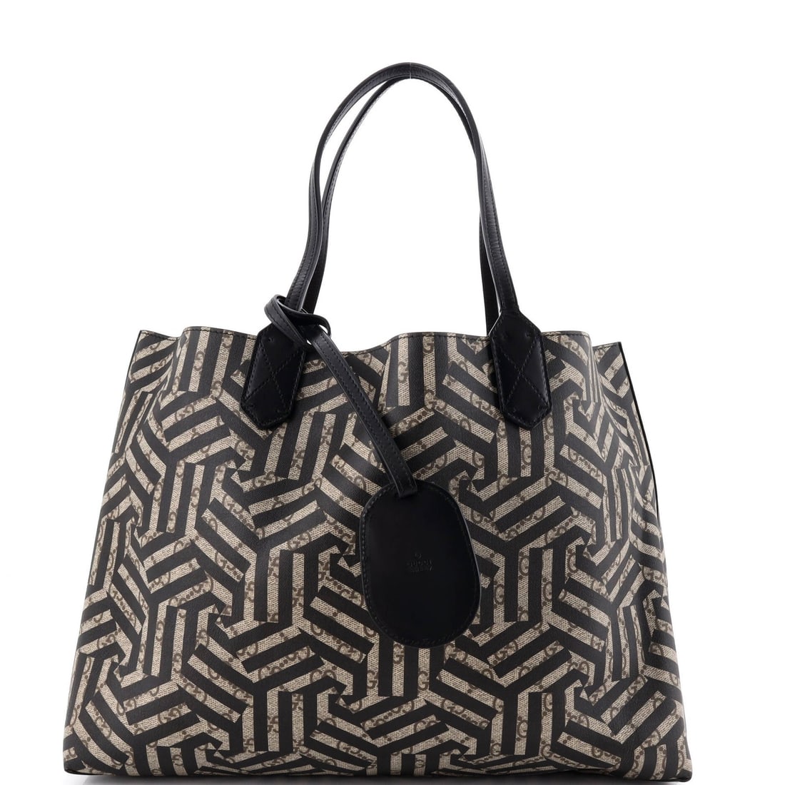 Reversible GG Print Leather Tote Caleido Gucci Medium: Reversible GG Print Leather Tote Caleido Gucci Medium Brown Reversible Tote with Canvas Coated Exterior and Leather Interior, Featuring a Classic GG Print Design, Available in Medium Size. This medium
