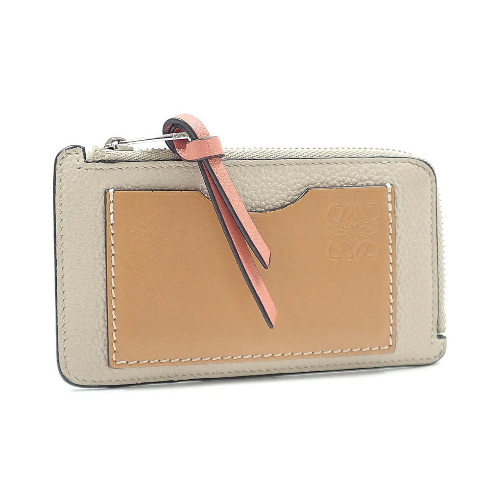 Card Case Leather by Loewe: Card Case Leather by Loewe Card case by Loewe in high-quality calfskin leather, measuring 7.5cm x 13cm x 1cm. This elegant accessory features a classic design that complements any style. Made from pre