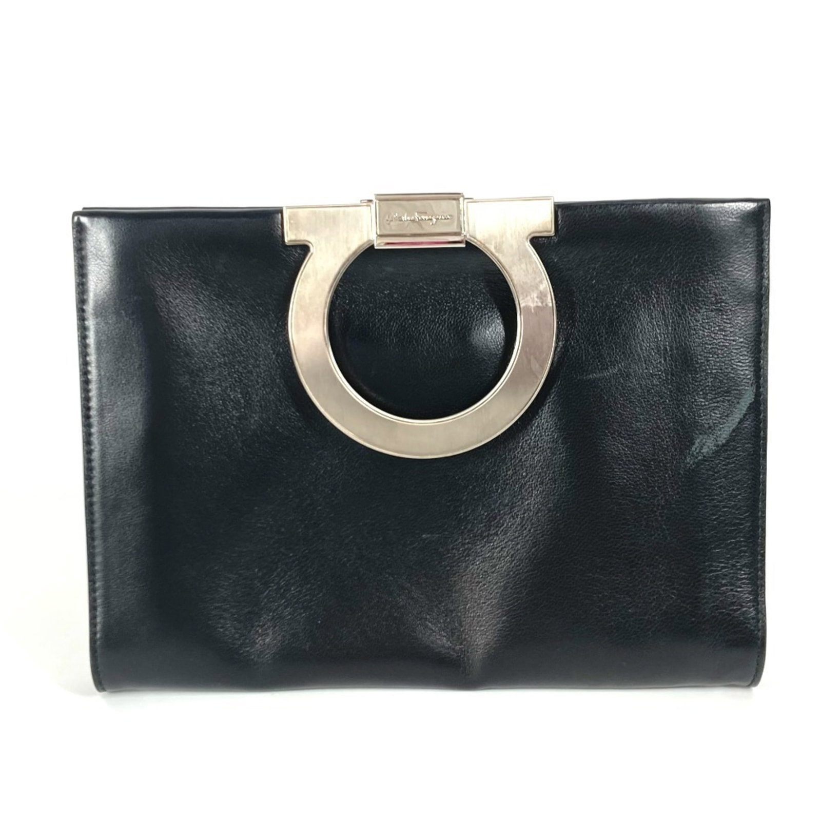 Salvatore Ferragamo Clutch Leather Bag: Salvatore Ferragamo Clutch Leather Bag Item Specifics: Brand: Salvatore Ferragamo Line: Gancini Type: Clutch bag Material: Leather Color: Black Gender: Men,Women,Unisex Size (HxWxD): 16.5cm x 23cm /
