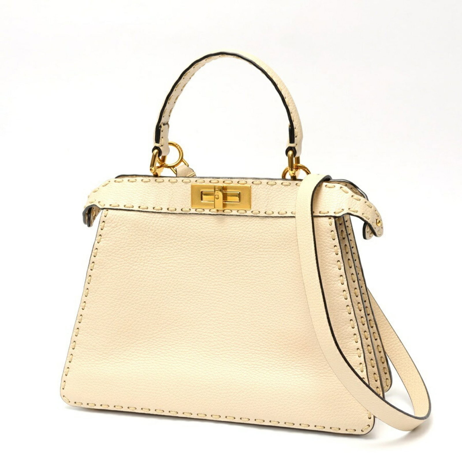 Shoulder Bag Leather Fendi Handbag: Shoulder Bag Leather Fendi Handbag This luxurious Fendi shoulder bag is crafted from high-quality leather, featuring a timeless ivory color that exudes elegance. Measuring 25.5cm x 33.5cm x 13cm, it c