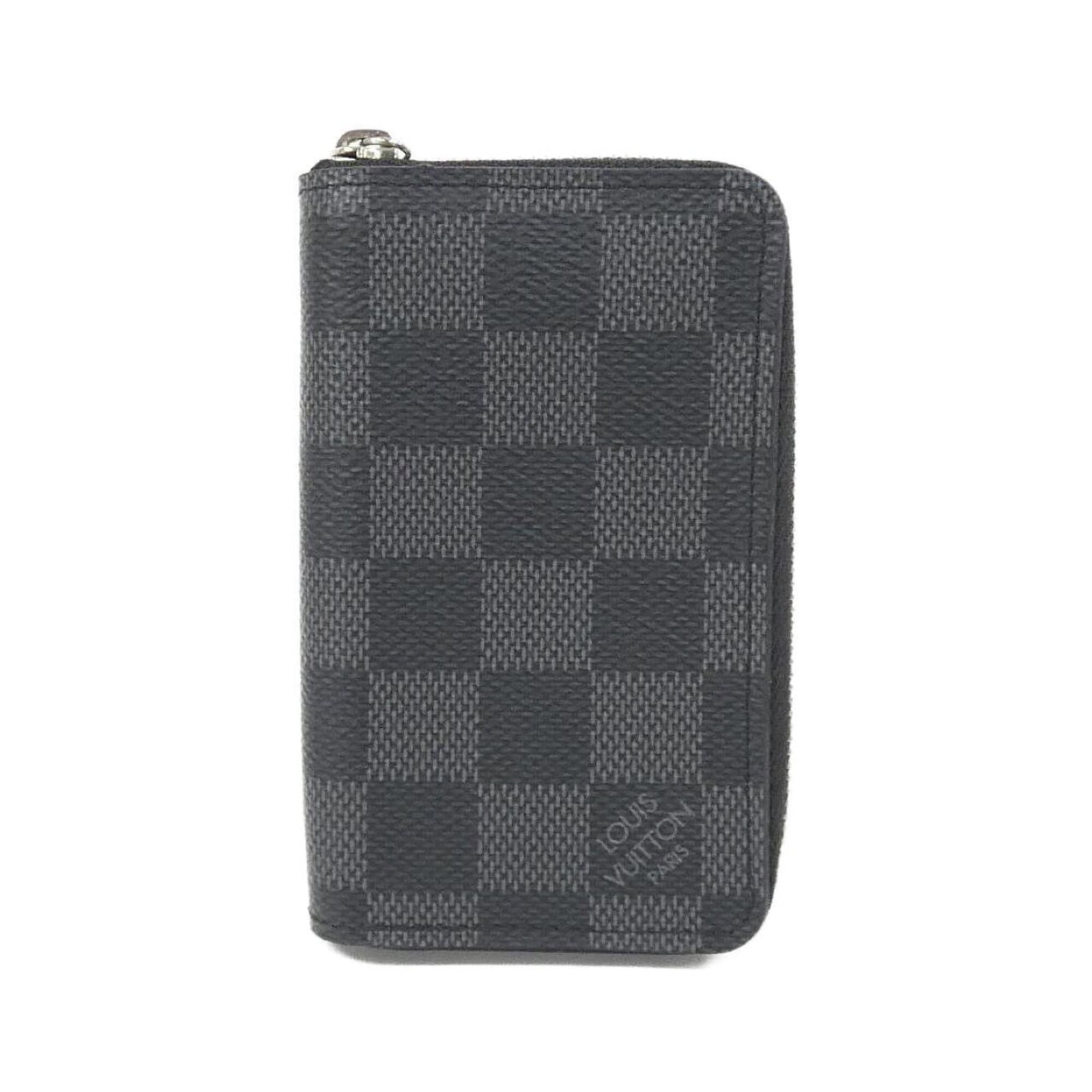 Louis Vuitton Coin Purse/ Coin Case Coated Canvas: Louis Vuitton Coin Purse/ Coin Case Coated Canvas Coated canvas material provides a durable and stylish finish, while the graphite color offers a versatile and timeless look. This compact coin purse