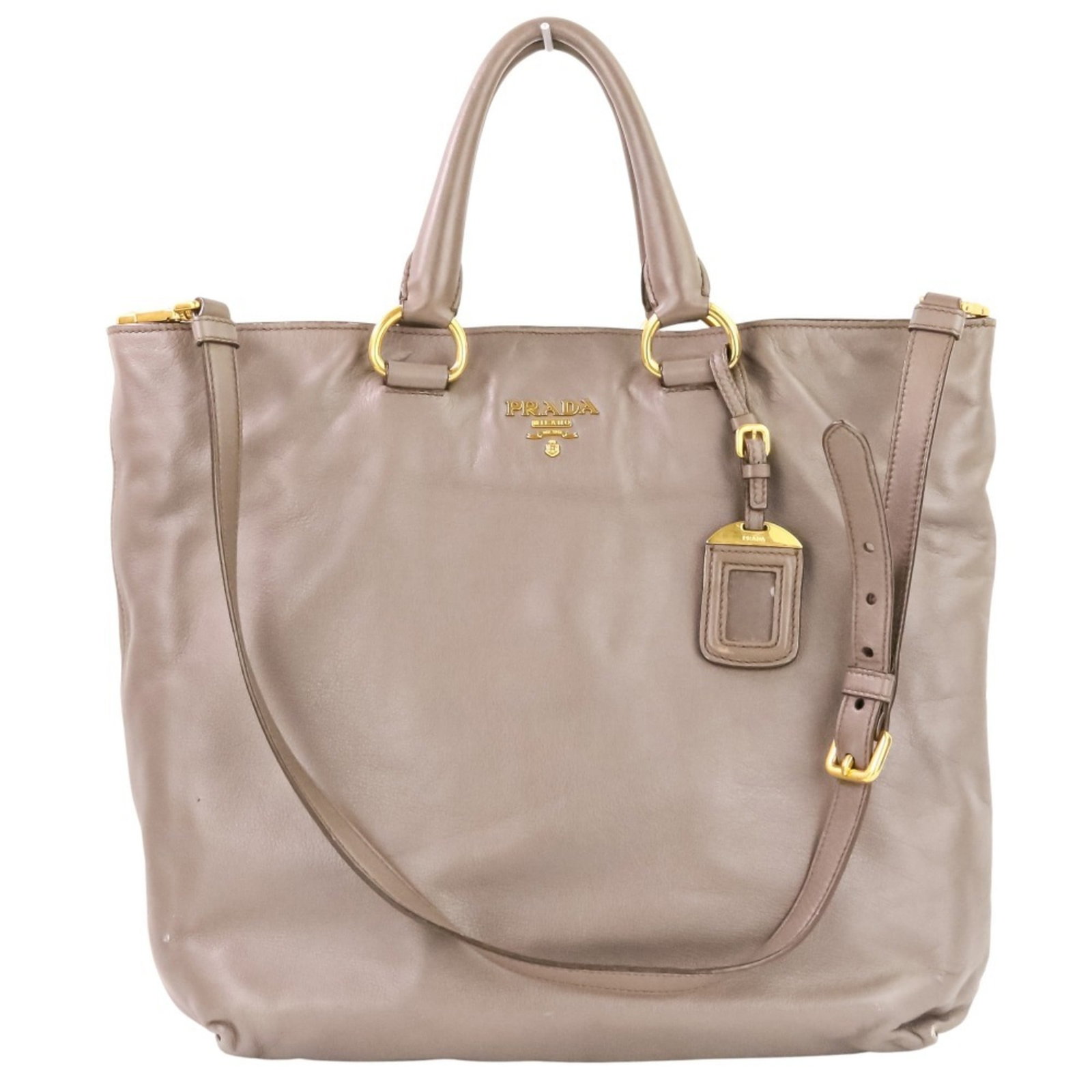 Shoulder Bag Leather Tote: Shoulder Bag Leather Tote Grayish leather shoulder bag with a classic tote design, featuring a sturdy handle and adjustable strap. The bag measures 32.5cm x 42cm x 11cm and has a handle length of