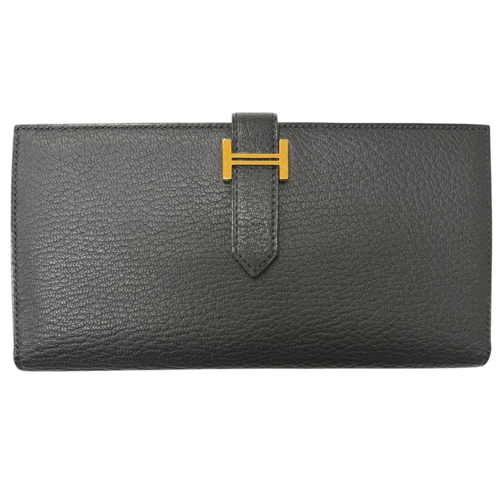 Chevre Leather Bi Fold Hermes Wallet: Chevre Leather Bi Fold Hermes Wallet Chevre leather bi-fold wallet from Hermes, crafted in France with a sleek black finish. Measuring 9.3cm x 17.5cm x 1.5cm, this long wallet features a classic