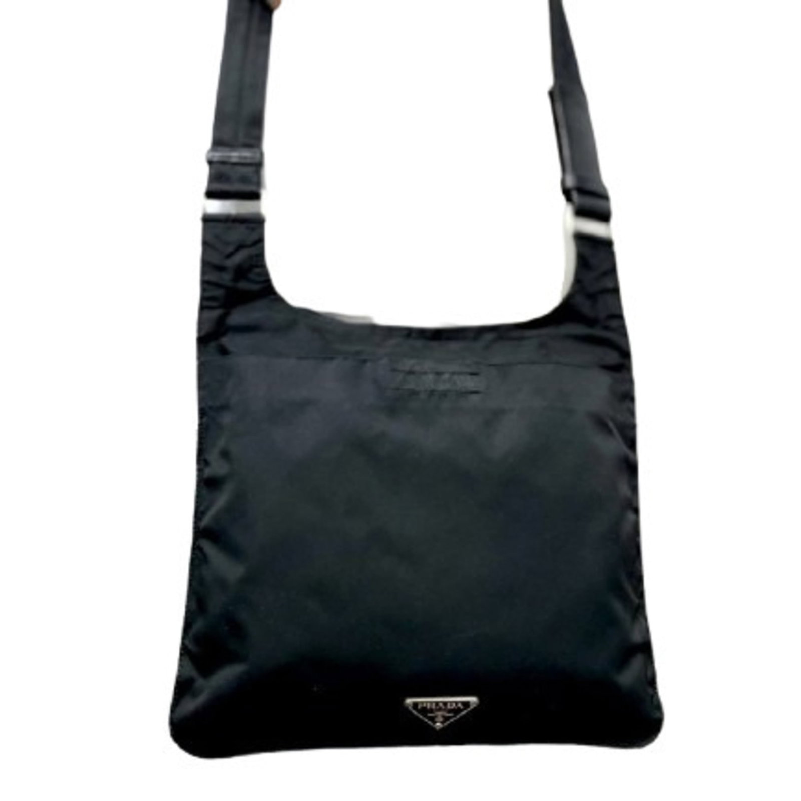 Shoulder Bag Nylon Leather Prada: Shoulder Bag Nylon Leather Prada Nylon and leather combine in this sleek black shoulder bag from Prada, measuring 24cm x 25cm. The bag's material and design make it a versatile accessory for everyday