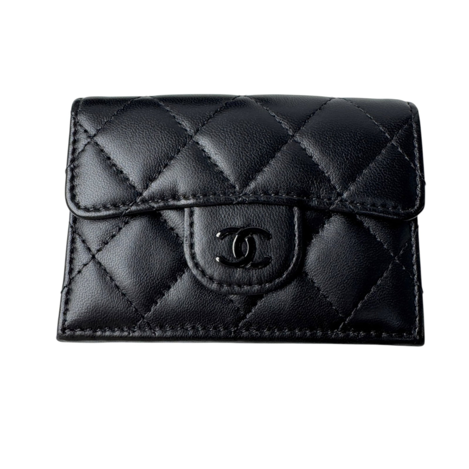 Chanel Wallet (Tri-Fold) Leather: Chanel Wallet (Tri-Fold) Leather Tri-fold leather wallet from Chanel, crafted from lambskin in black. This classic design measures 7cm x 10.5cm and features a sleek, timeless aesthetic. Item