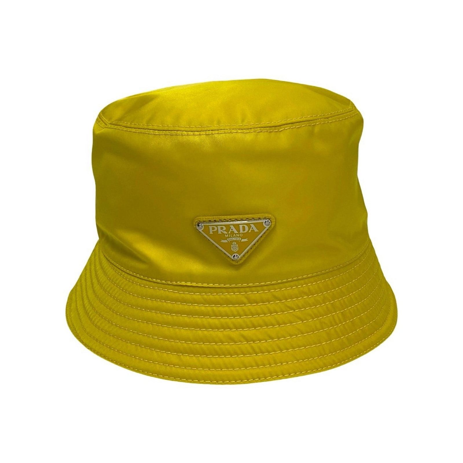Nylon Prada Hat Bucket: Nylon Prada Hat Bucket Yellow nylon bucket hat from Prada, measuring 14cm in height and 58cm in circumference, made from high-quality nylon material. Comes with a dust bag for storage and protection.