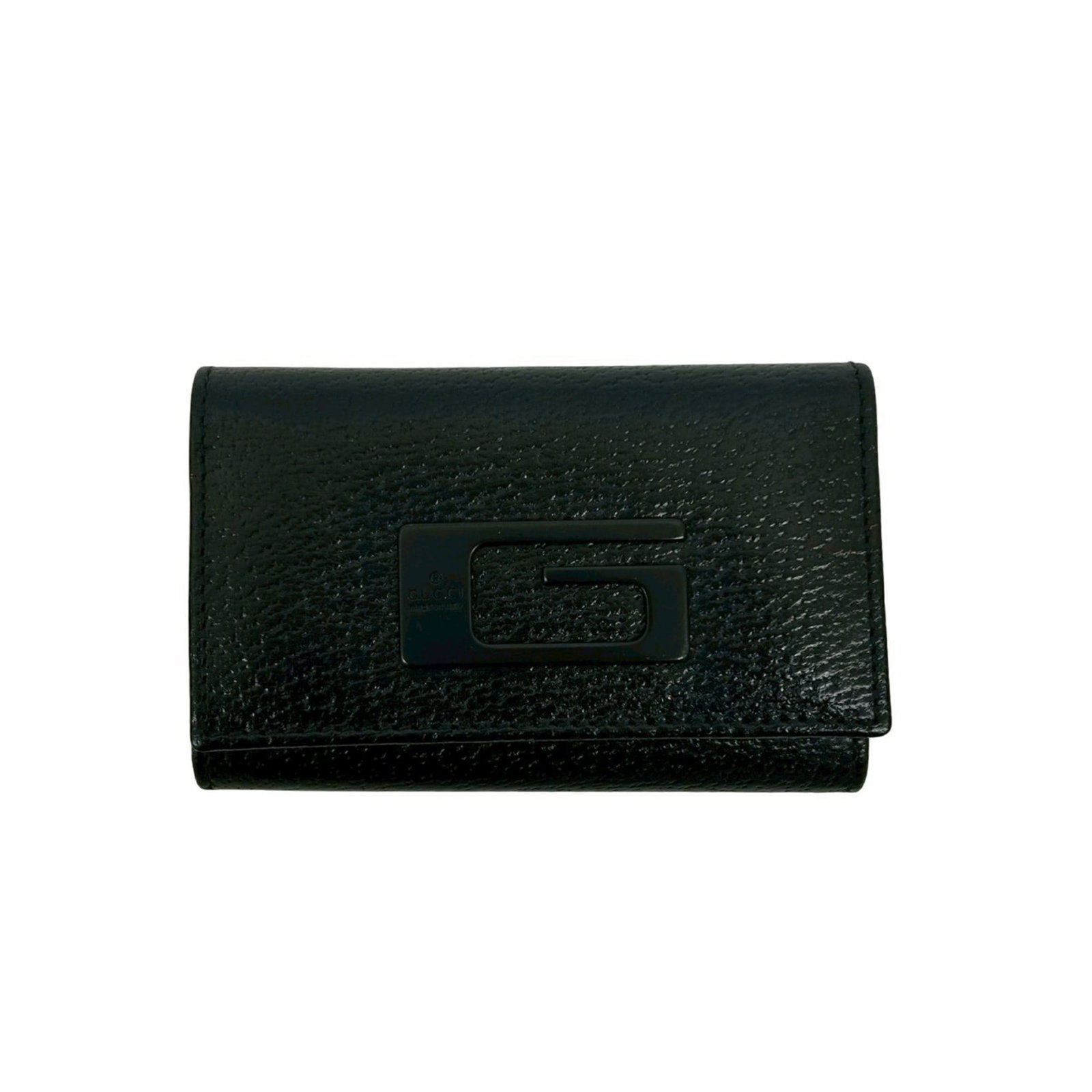 Keycase Leather Gucci: Keycase Leather Gucci Black leather keycase from Gucci, measuring 6cm x 9.5cm x 1.5cm. This small, stylish accessory features genuine leather construction and a sleek design. Item Specifics: Brand: