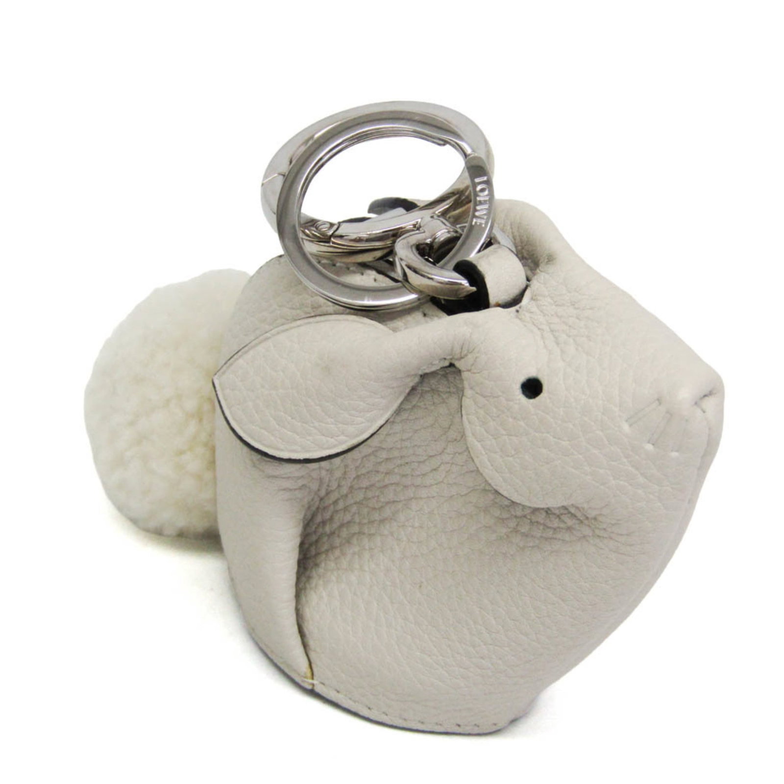 Loewe Coin Purse/ Coin Case Leather: Loewe Coin Purse/ Coin Case Leather The Loewe Coin Purse features a striking white leather exterior with metal fittings, adorned with a charming rabbit charm. A small zipper closure secures the interi