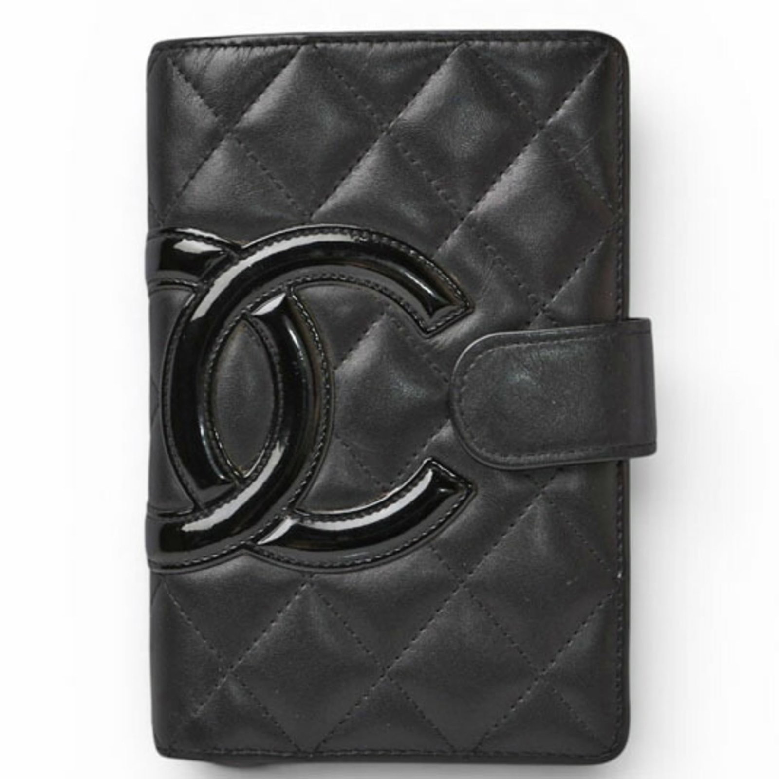 Chanel Wallet (Bi-Fold) Leather: Chanel Wallet (Bi-Fold) Leather Black leather bi-fold wallet from Chanel, made in Spain with a sleek 15cm x 10cm x 2.5cm design. This classic wallet features a timeless black color and a durable