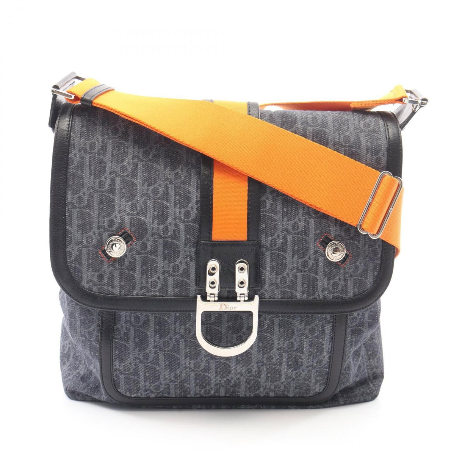 Christian Dior Shoulder Bag in Denim Leather: Christian Dior Shoulder Bag in Denim Leather Denim leather craftsmanship meets timeless elegance in this Christian Dior shoulder bag, available in three striking colors: black, navy, and orange. With