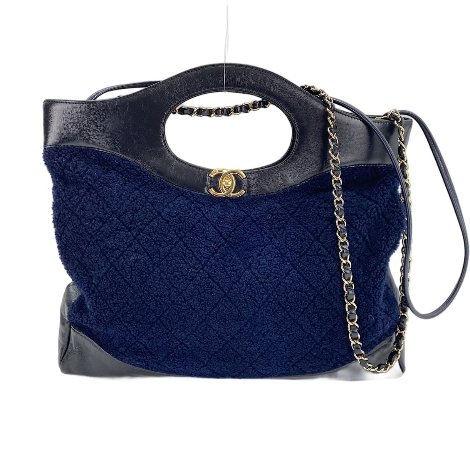 Shoulder Bag by Chanel: Shoulder Bag by Chanel Navy blue Chanel shoulder bag with a classic design, featuring a 32cm x 37cm x 8cm size and adjustable strap length of 87cm - 89cm. The bag's navy color and sleek lines make it