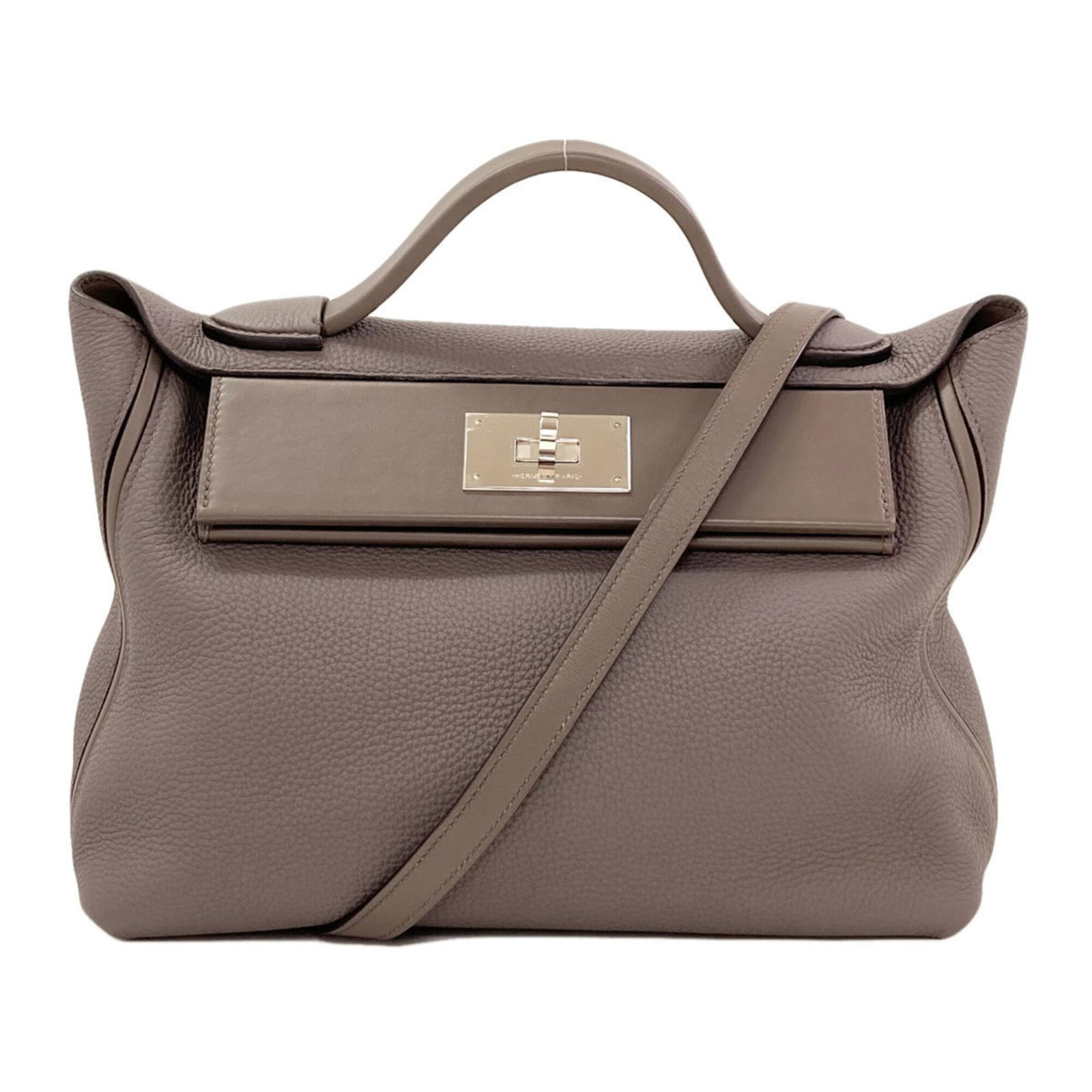 Hermes Handbag Togo Leather: Hermes Handbag Togo Leather Togo leather craftsmanship shines in this iconic Hermes handbag, boasting a timeless design and premium material. Measuring 20cm x 29cm x 14cm, this compact yet elegant