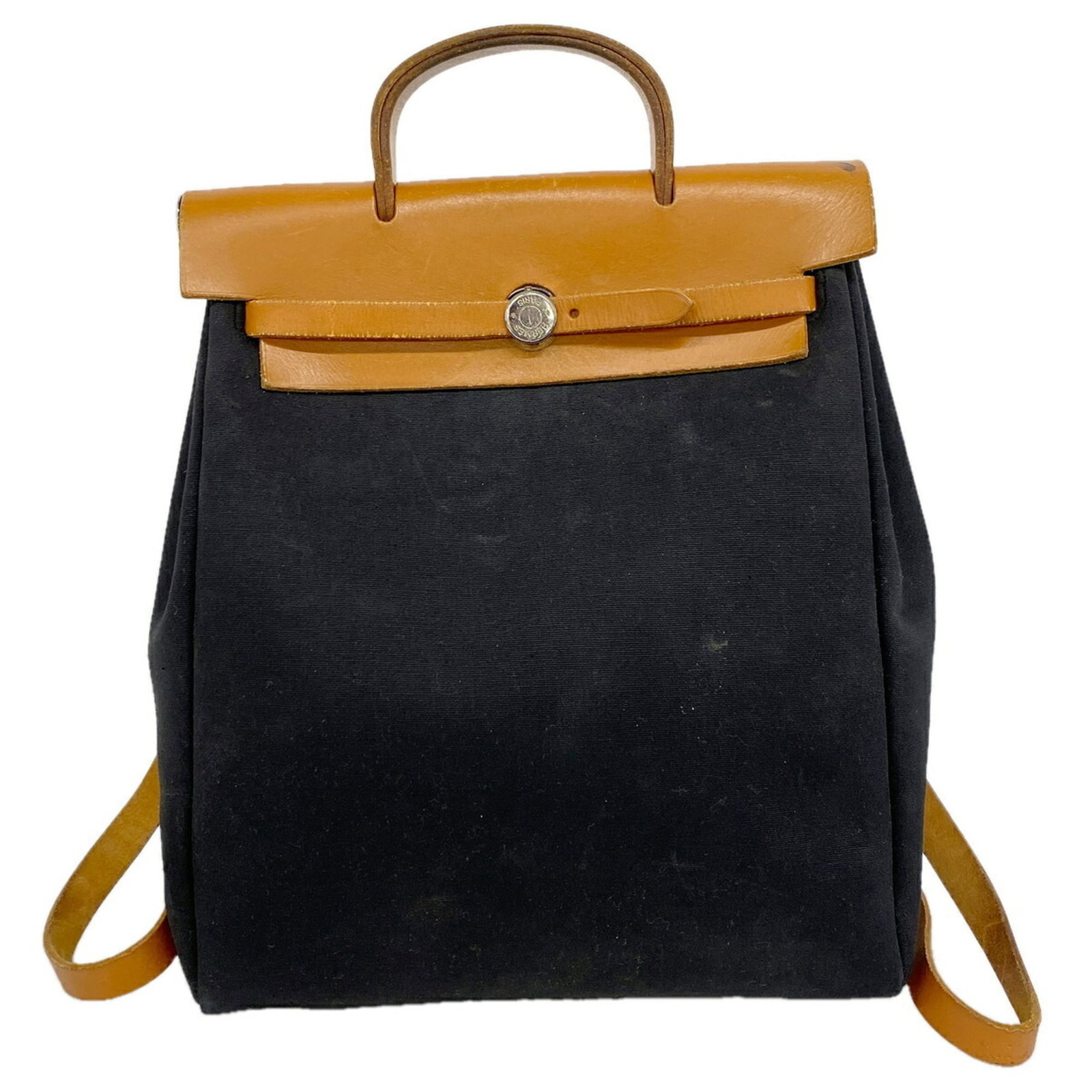 Backpack Officier Toile Hermes: Backpack Officier Toile Hermes The Toile Officier Backpack from Hermes is a stylish and sophisticated accessory, featuring a classic black and natural color combination and silver hardware. This