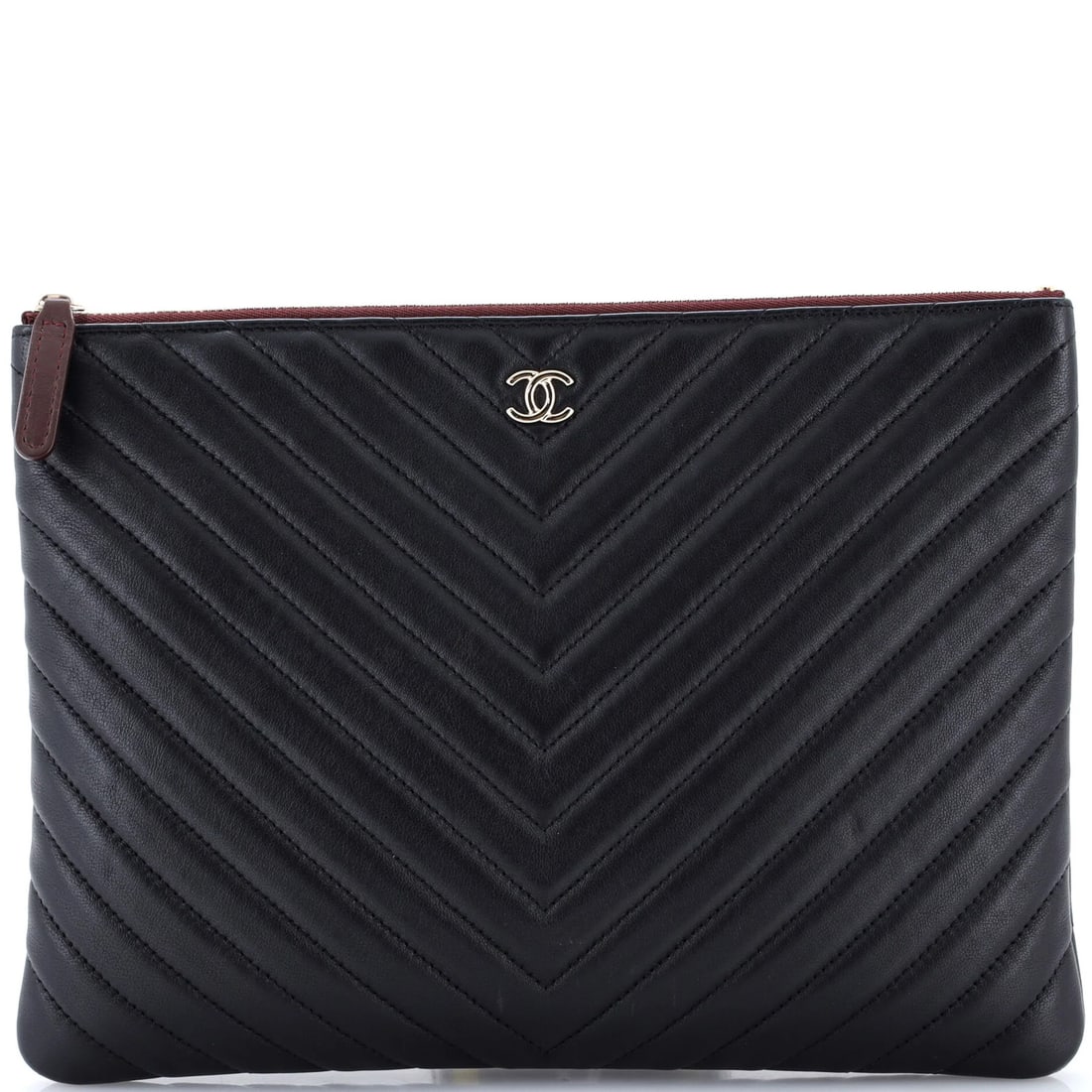 Calfskin Chevron Calfskin Large Chanel O Case Clutch: Calfskin Chevron Calfskin Large Chanel O Case Clutch Black Calfskin Chevron Clutch in Large Size. This exquisite Chanel O Case Clutch boasts a sleek black exterior with a rich, burgundy interior,