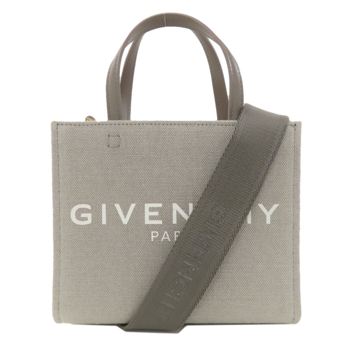2Way Canvas Handbag Givenchy: 2Way Canvas Handbag Givenchy Gray canvas handbag from Givenchy, featuring a classic 2Way design. This versatile bag combines style and functionality, making it a great addition to any wardrobe. With