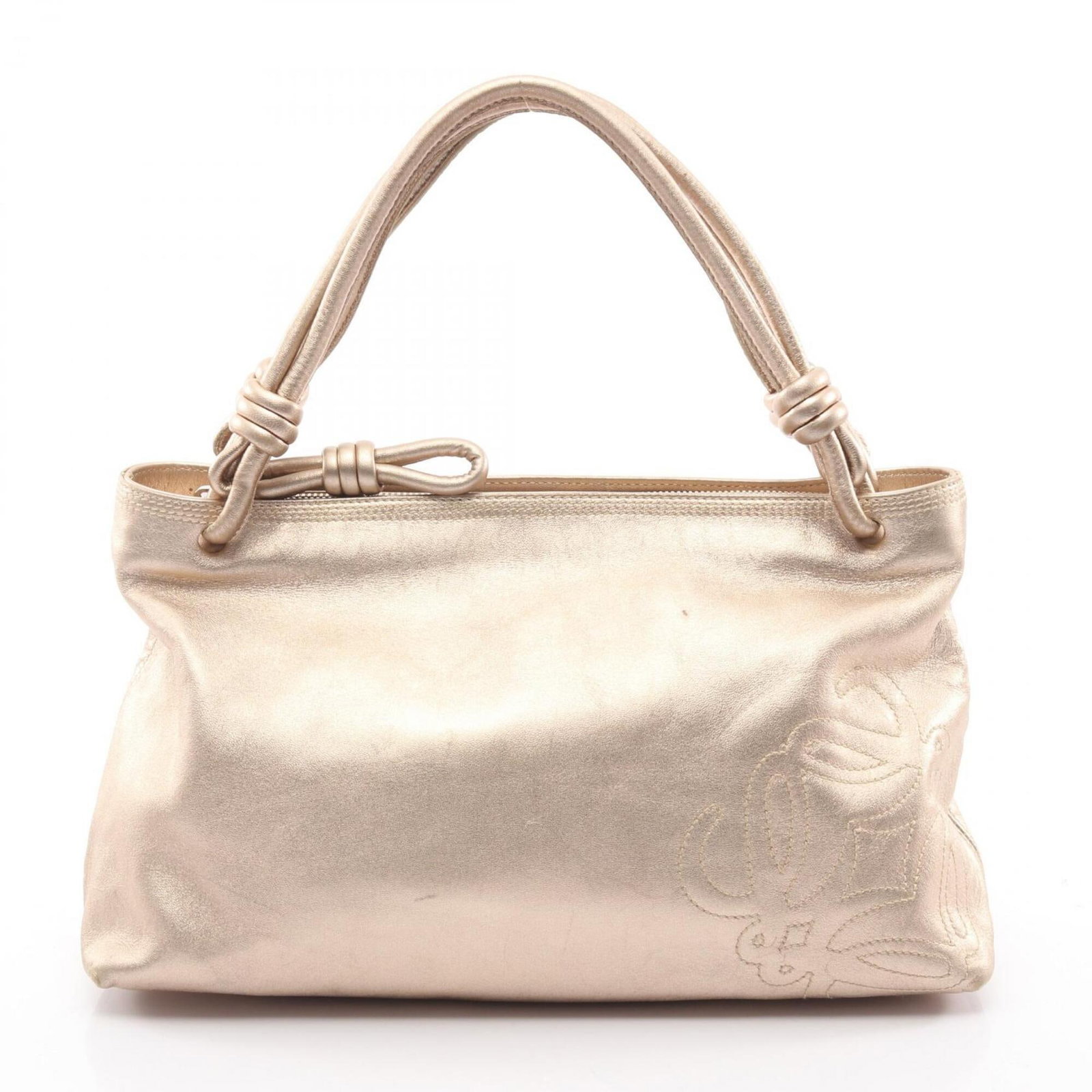 Handbag Leather Handbag: Handbag Leather Handbag This gold leather handbag from Loewe measures 19.5cm x 32.5cm x 10.5cm and features a classic design. The bag's gold leather exterior adds a touch of sophistication, while its