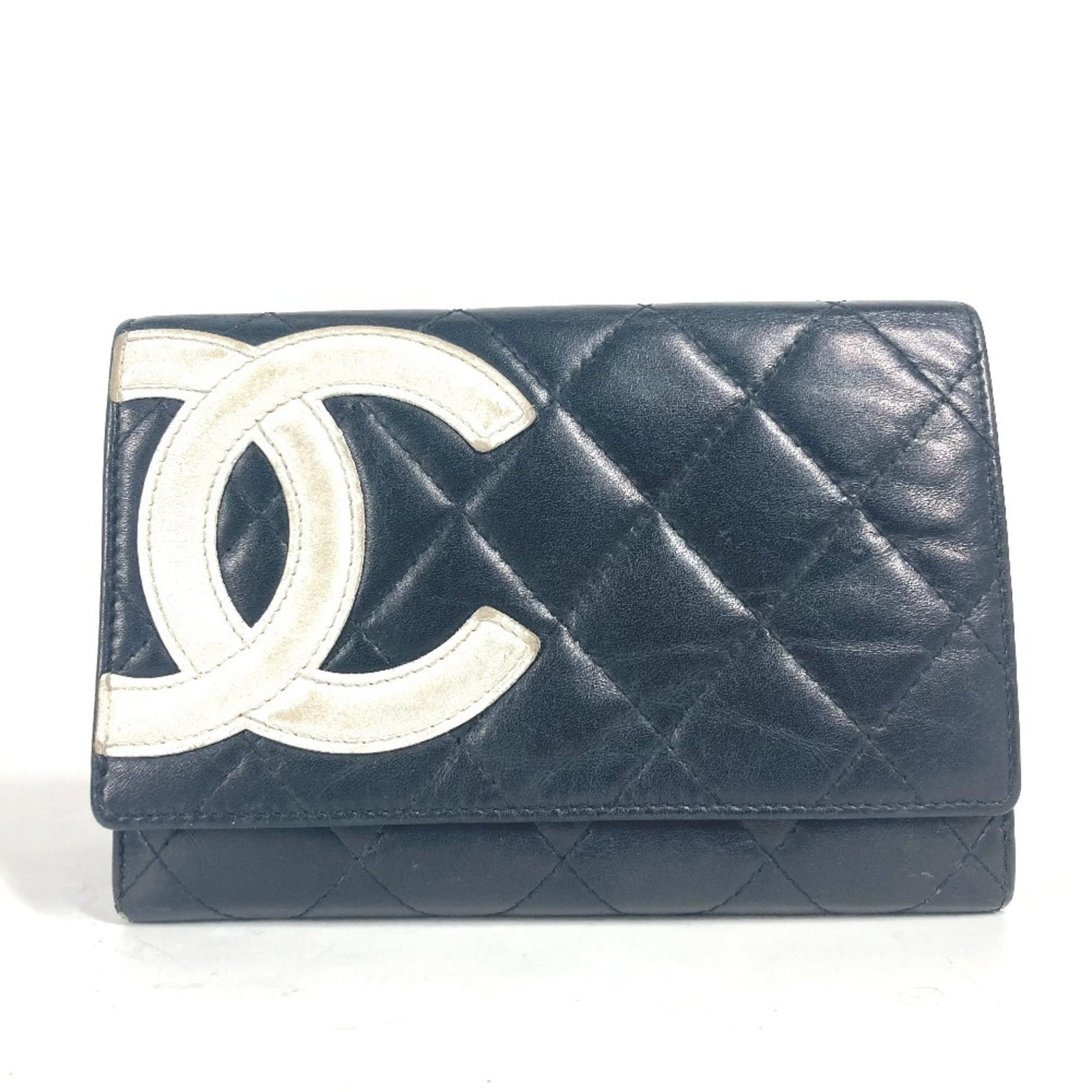 Chanel Bi Fold Leather Wallet: Chanel Bi Fold Leather Wallet Black or White leather, 10cm x 14.5cm in size, with a classic bi-fold design. This Chanel wallet features high-quality leather construction and a timeless design. The sig