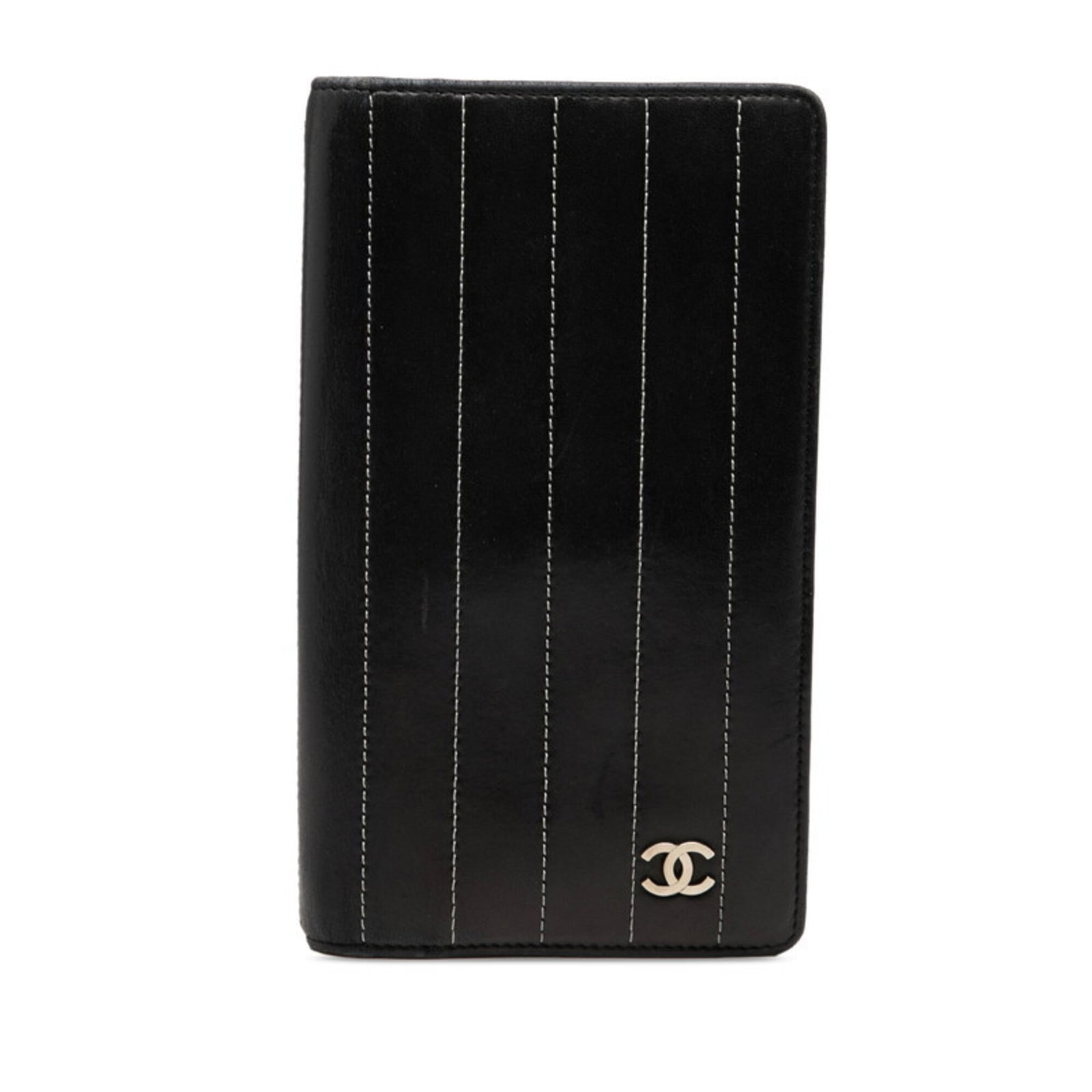 Chanel Long Wallet (Bi-Fold) Leather: Chanel Long Wallet (Bi-Fold) Leather Black lambskin Chanel long wallet with a sleek bi-fold design, measuring 18.5cm x 10.5cm x 2cm. This classic leather wallet features a timeless look and a compact 