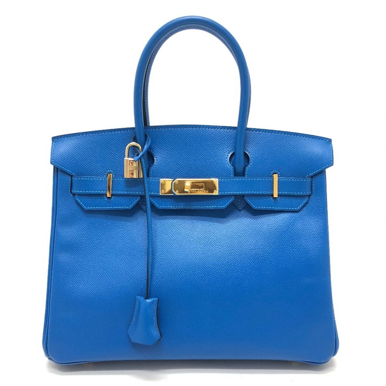 Handbag Epsom Leather by Hermes: Handbag Epsom Leather by Hermes Epsom leather handbags are renowned for their exceptional durability and luxurious feel. This particular Epsom leather handbag by Hermes boasts a striking blue hue and 