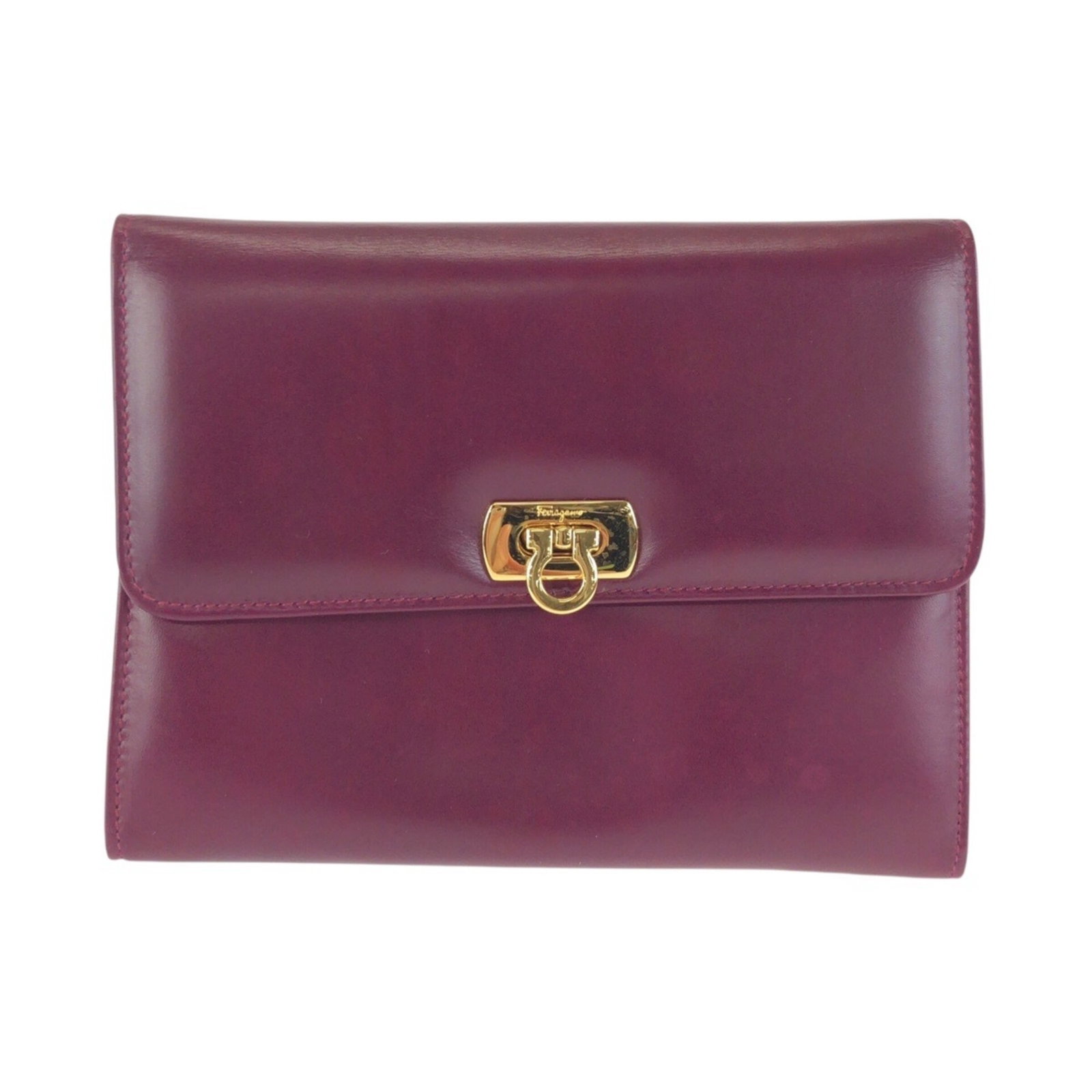Salvatore Ferragamo Clutch Leather Pouch Bag: Salvatore Ferragamo Clutch Leather Pouch Bag Salvatore Ferragamo's sleek leather clutch is a sophisticated addition to any evening ensemble, with its rich purple hue and compact 12cm x 16cm x 4cm