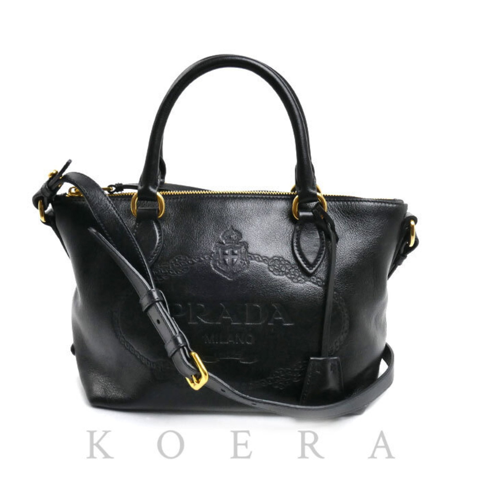 Shoulder Bag Leather Prada: Shoulder Bag Leather Prada This black leather shoulder bag from Prada features a classic design with gold hardware, measuring 17cm x 30cm x 13cm. Made from high-quality leather, the bag's sleek and