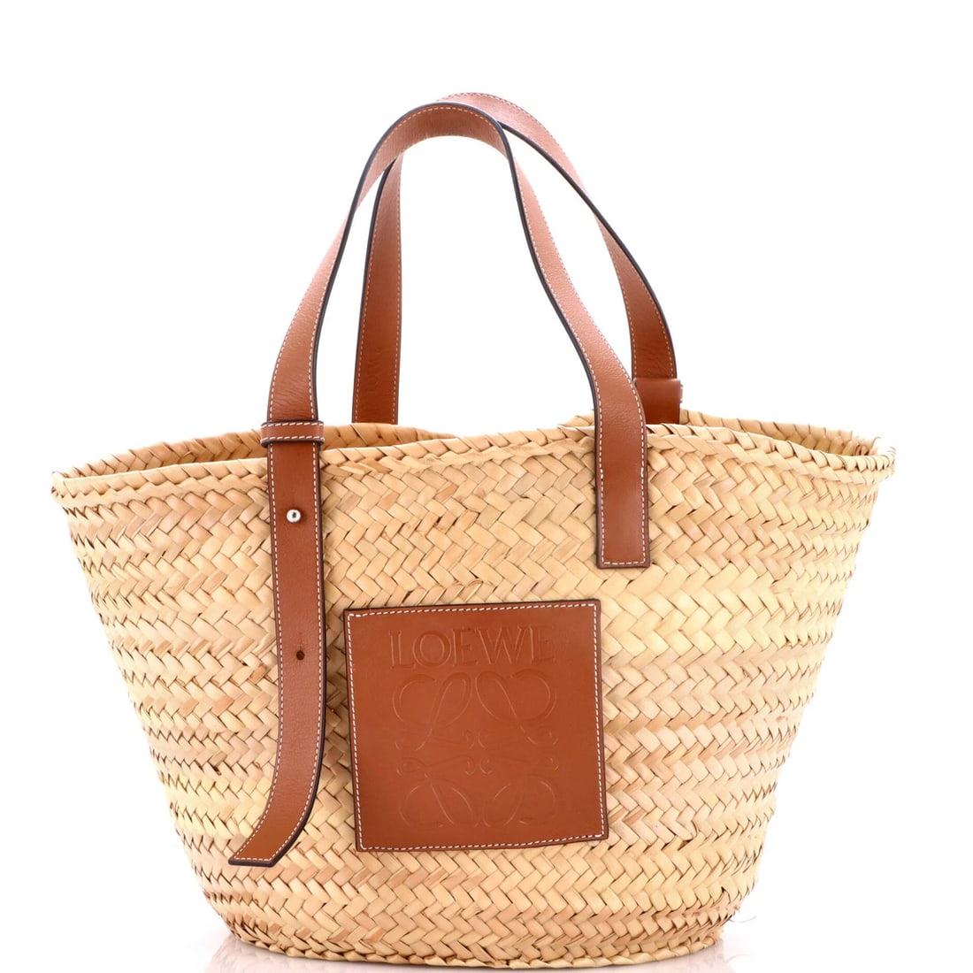 Raffia Medium Loewe Basket Tote: Raffia Medium Loewe Basket Tote Raffia Medium Loewe Basket Tote boasts a rich, earthy brown exterior crafted from high-quality raffia, complemented by a matching interior. The classic design features