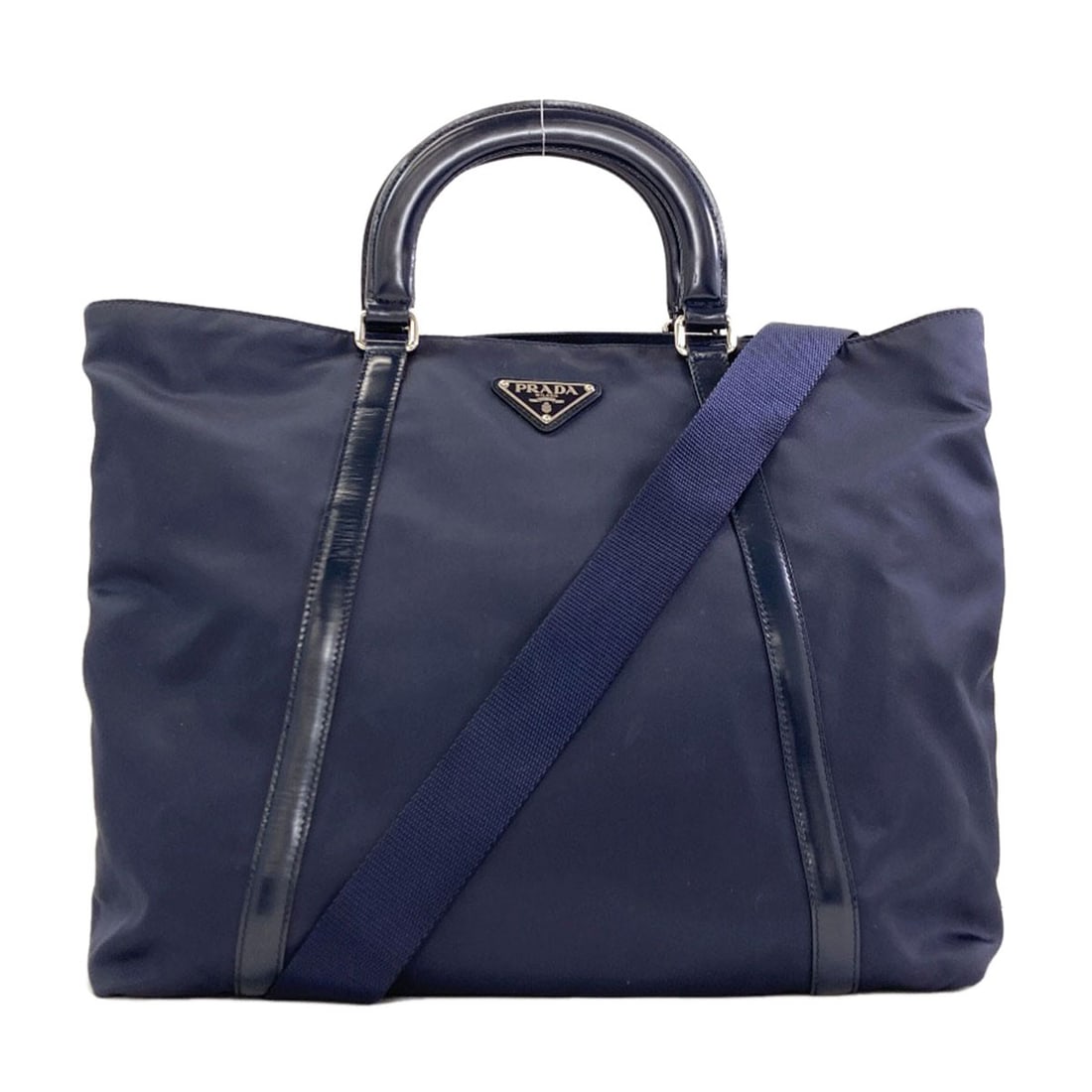 Handbag Nylon 2Way Logo Hardware Prada: Handbag Nylon 2Way Logo Hardware Prada Navy PRADA nylon handbag with 2-way logo hardware, featuring a zip closure and detachable strap. This 11.8 inch tall, 5.5 inch deep bag measures 13.4-16.5