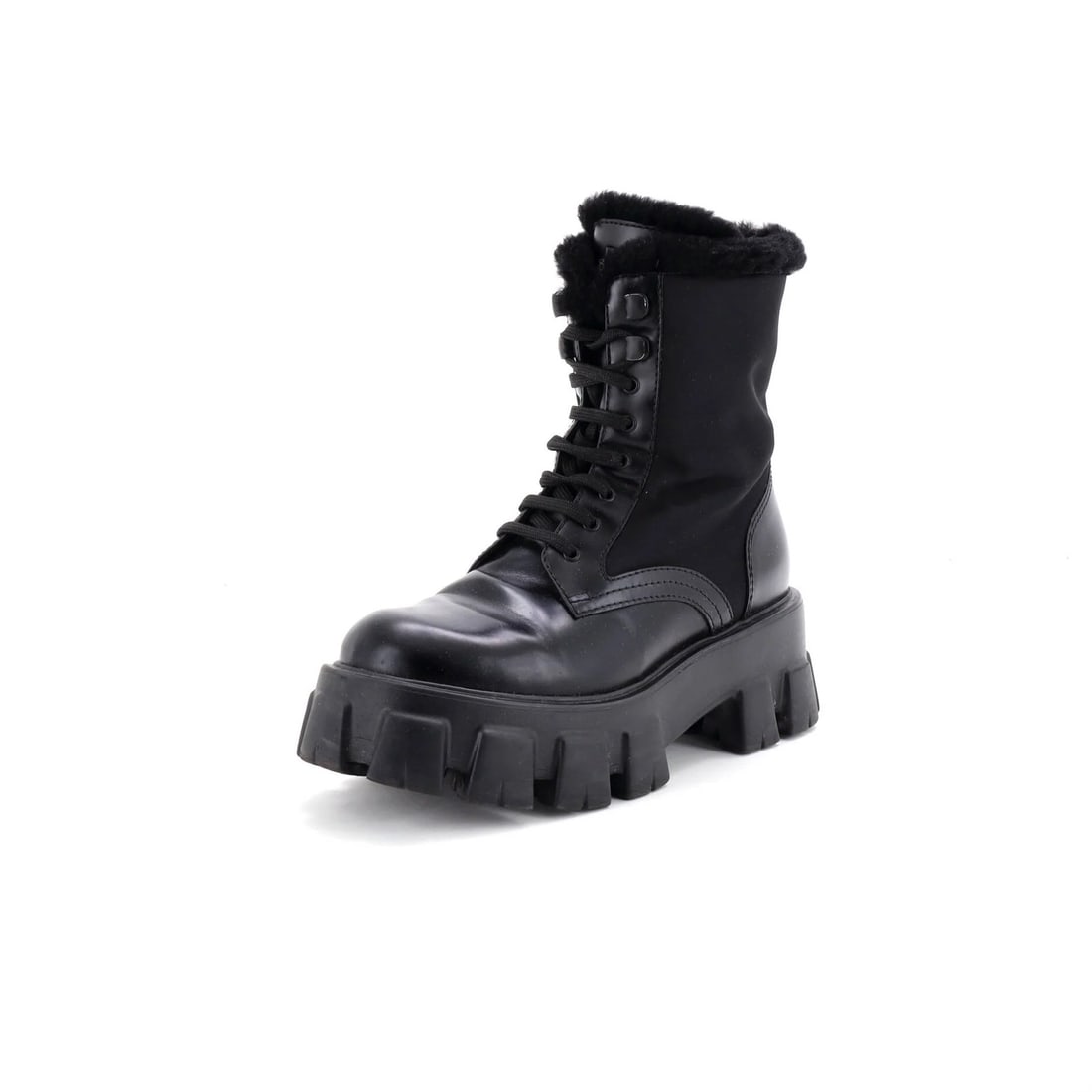 Prada Monolith Combat Boots Nylon and Leather with Shearling: Prada Monolith Combat Boots Nylon and Leather with Shearling Black Prada Monolith Combat Boots with a unique blend of leather, nylon, and shearling materials, featuring a striking exterior design and 