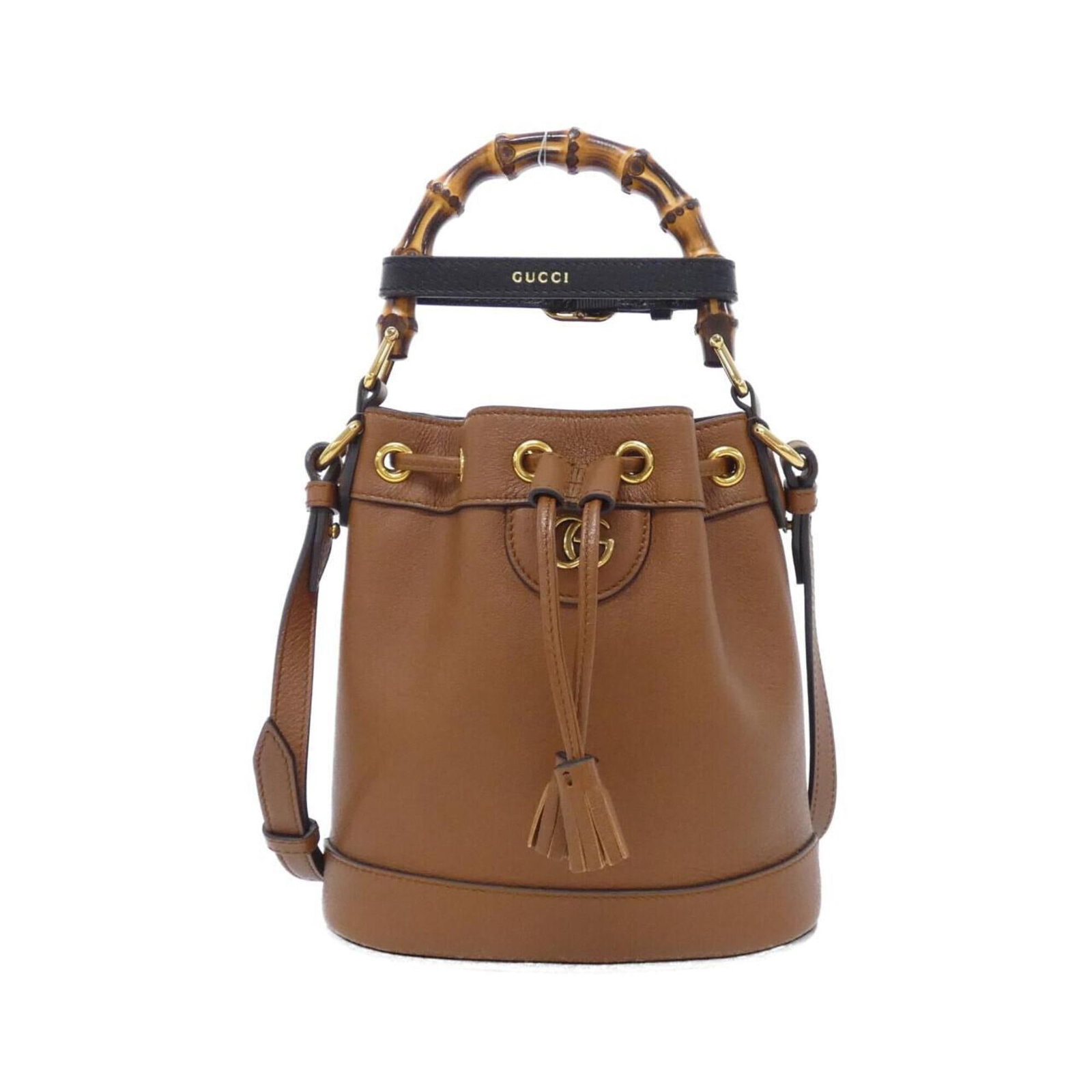 Handbag Leather Gucci: Handbag Leather Gucci Brown Leather Gucci Handbag. Made from high-quality leather, this classic handbag features a timeless design with a signature Gucci style. Standing 20cm tall and 19cm wide, it's