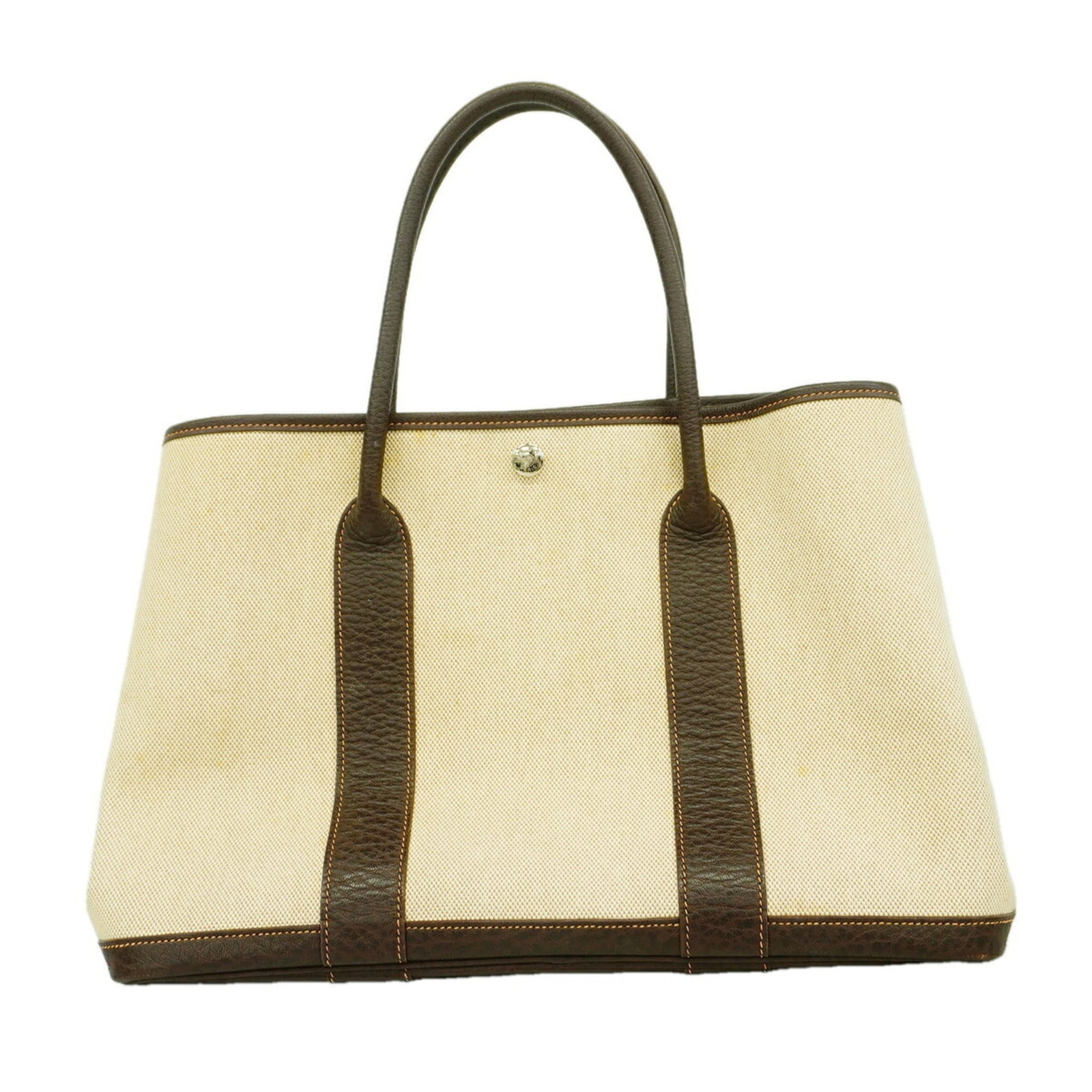 Tote Bag Toile Hermes: Tote Bag Toile Hermes Tote bag Toile Hermes features a classic design with a signature print, made from high-quality Toile H material in a rich brown color. The bag's silver hardware adds a touch of