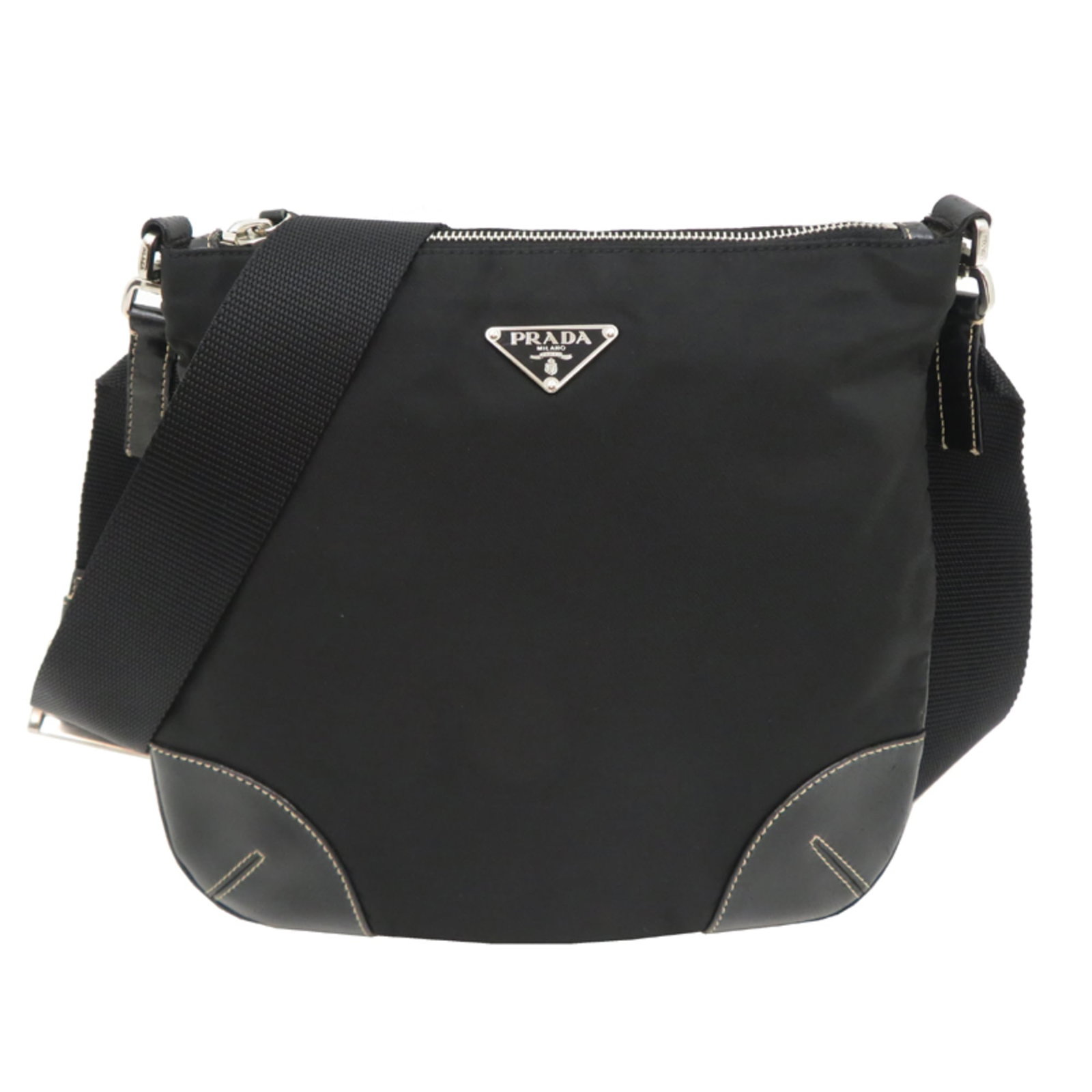 Shoulder Bag Nylon Leather Prada: Shoulder Bag Nylon Leather Prada Nylon and leather combine in this sleek shoulder bag from Prada, crafted in Italy with a black finish. Measuring 23cm x 25cm x 8.5cm, it features a striking design